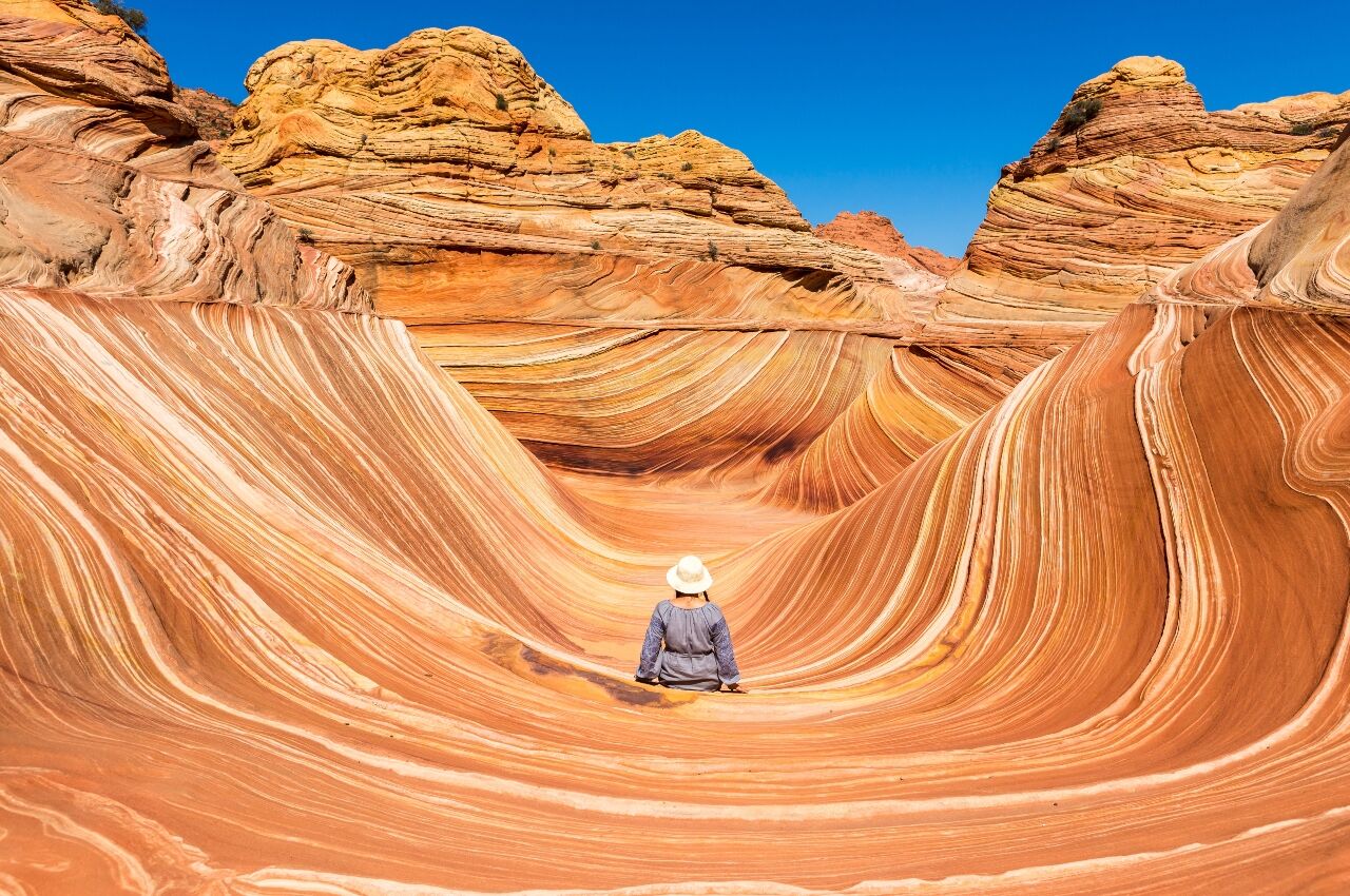 Woman sits on stone in Mesa, Arizona 