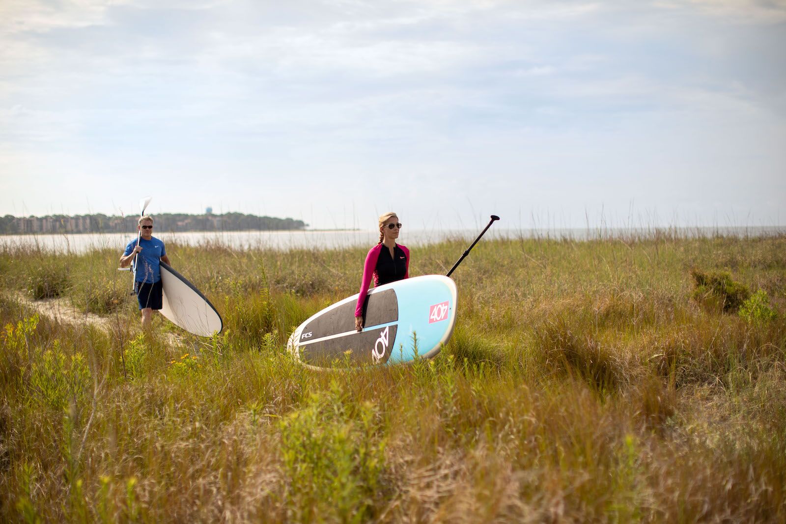 people taking their paddleboards to the water on Daufuskie Island