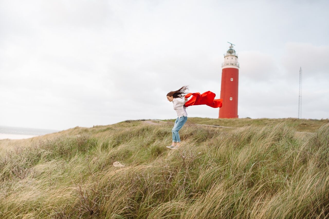woman walking in wind in Netherlands 