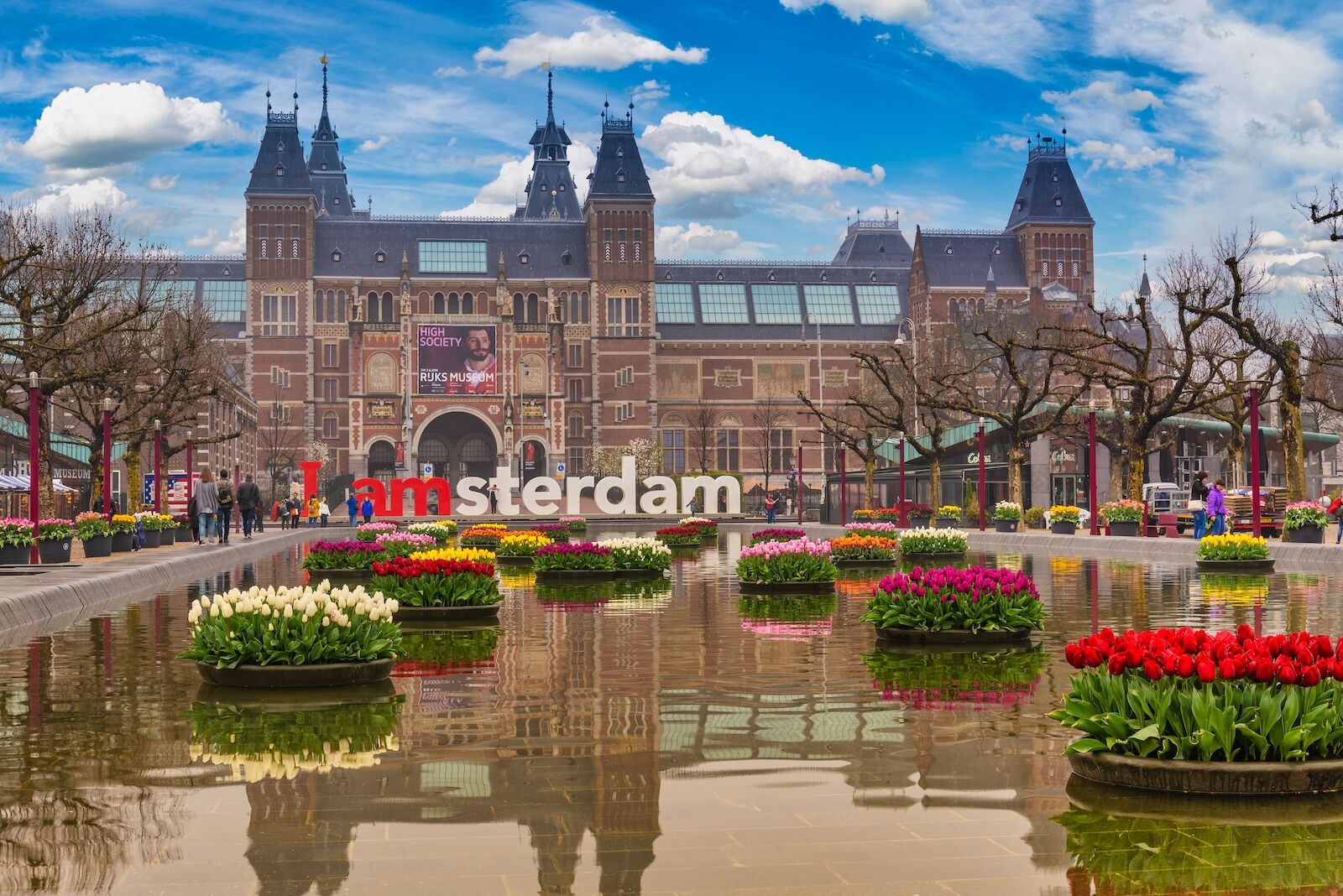 tulip beds in front of amsterdam sign