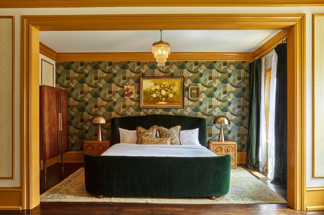 Grand bed in bedroom at The Guild House Hotel