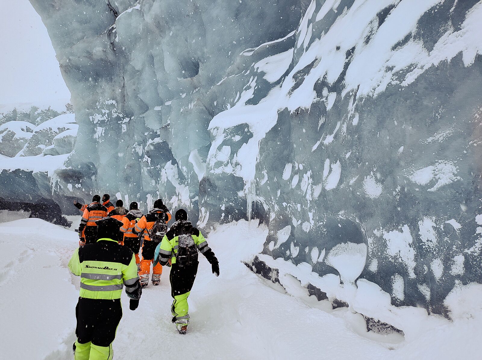 Hikers on the way to an iceland ice cave 