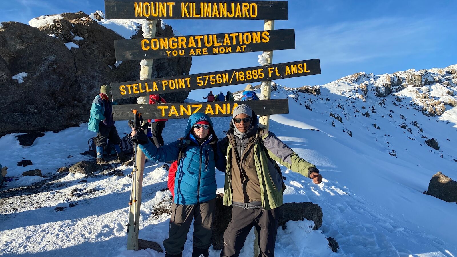 People at the top of Mount Kilimanjaro in Tanzania, where people speak Swahili