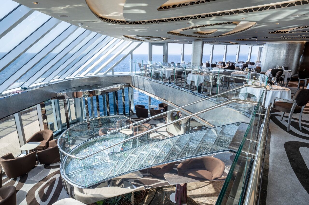 Lounge and glass staircase in MSC Yacht Club