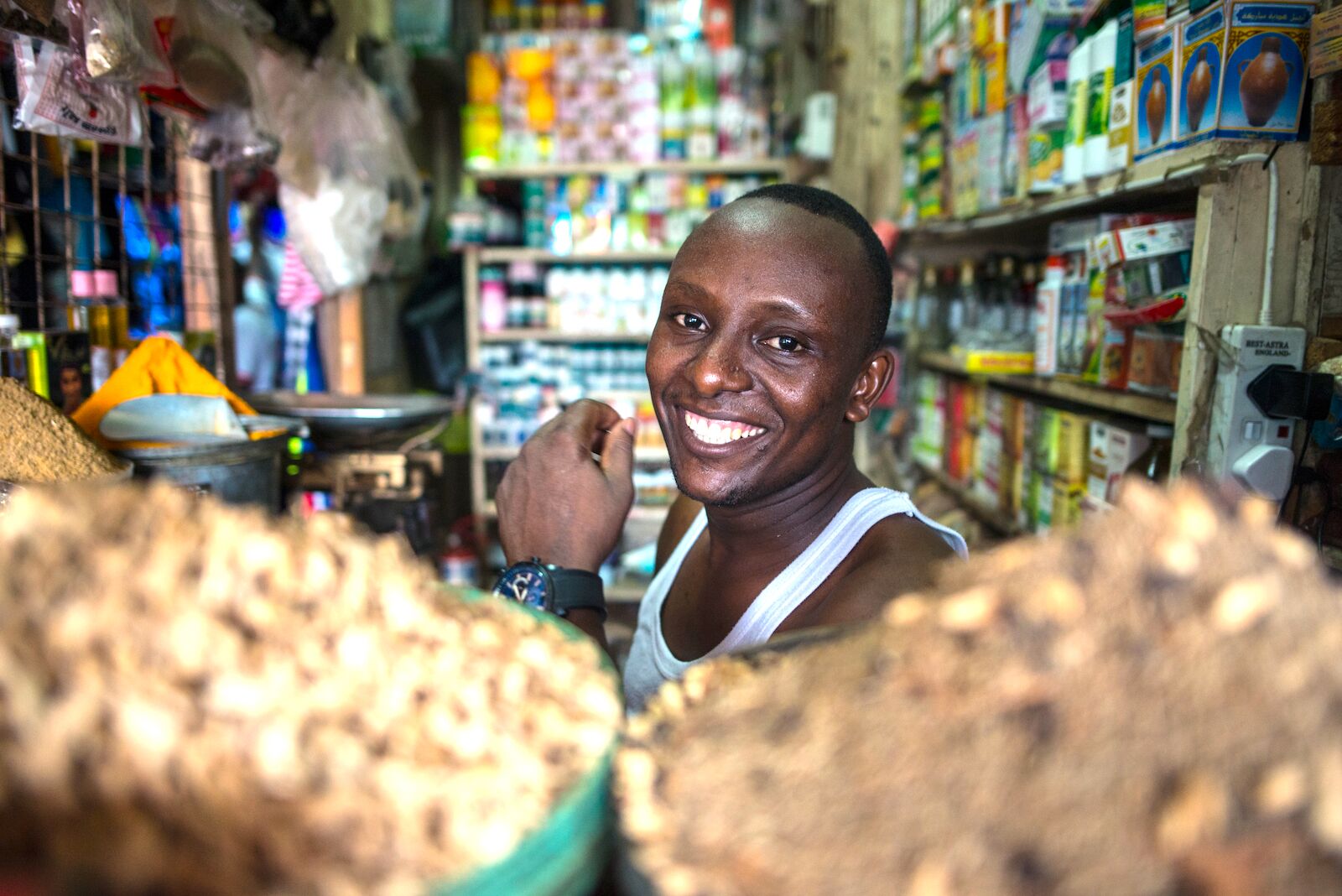 Shopkeeper in Kenya. In Kenya, people speak Swahili.
