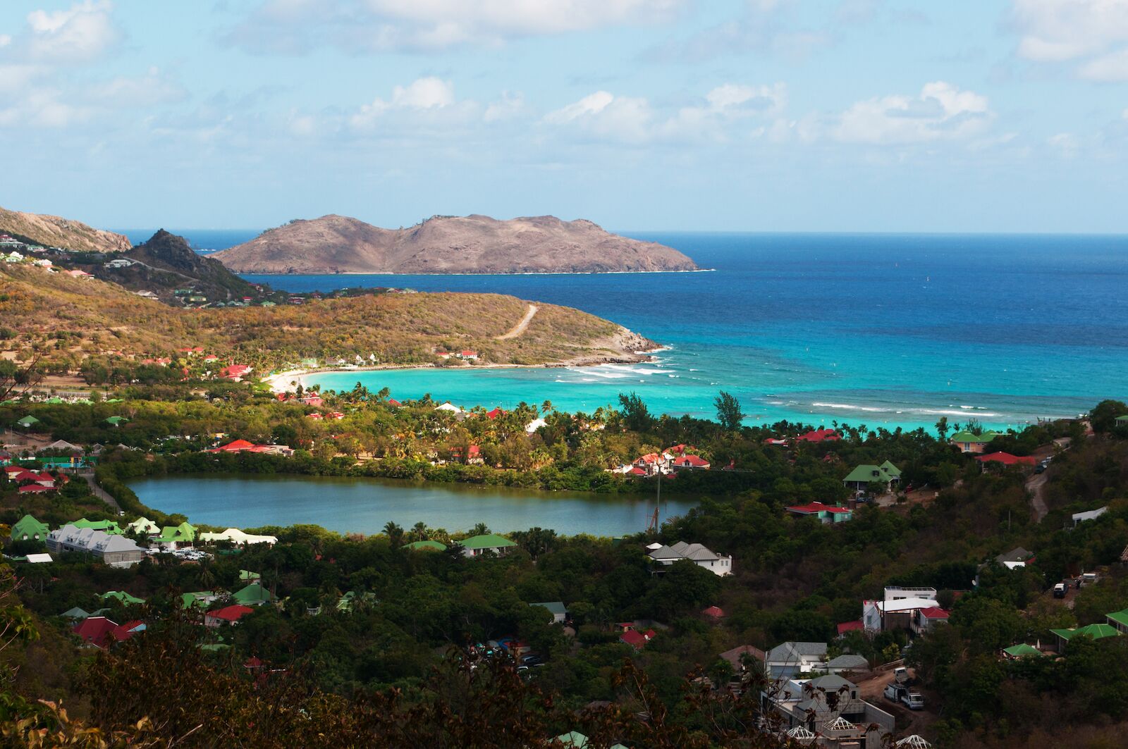 Saint Barthelemy (St Barth, St. Barths or St. Barts), Caribbean Sea, French West Indies, April 14, 2015: aerial view and skyline of the south Saline beach and bay (Anse de Grande Saline)