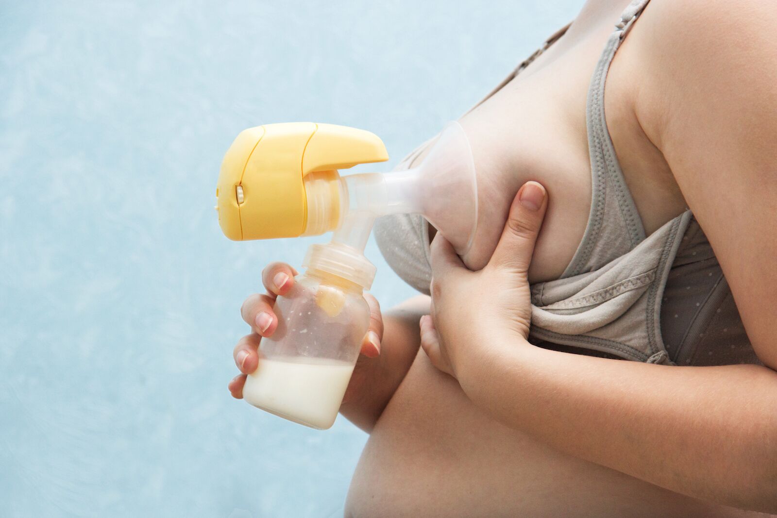 Mother pumping breast milk