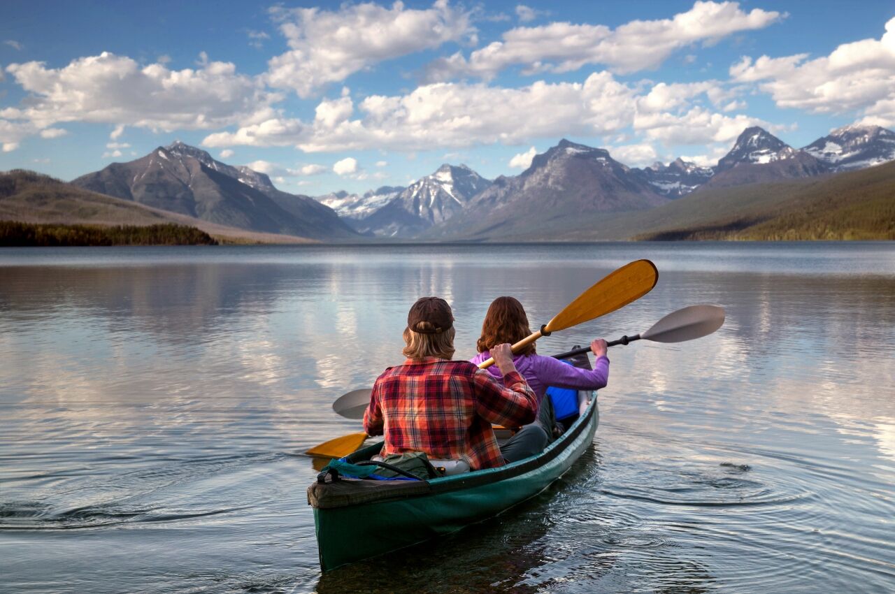 couple paddling at glacier national park