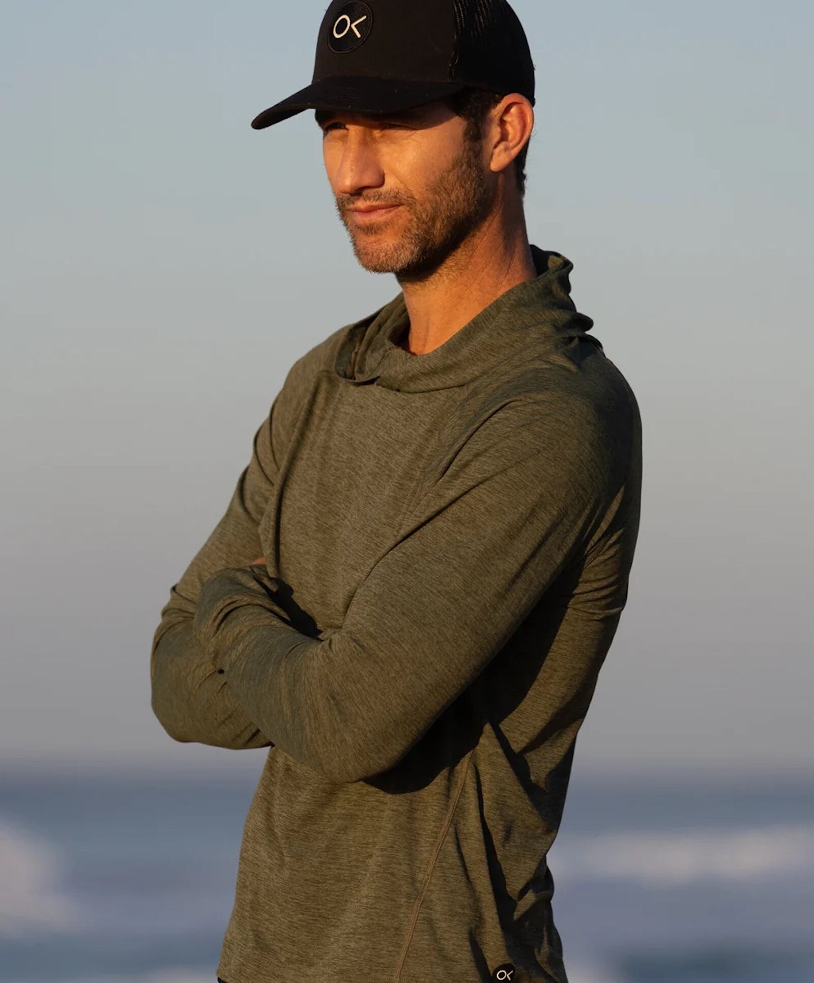 man in outerknown hooded sun shirt