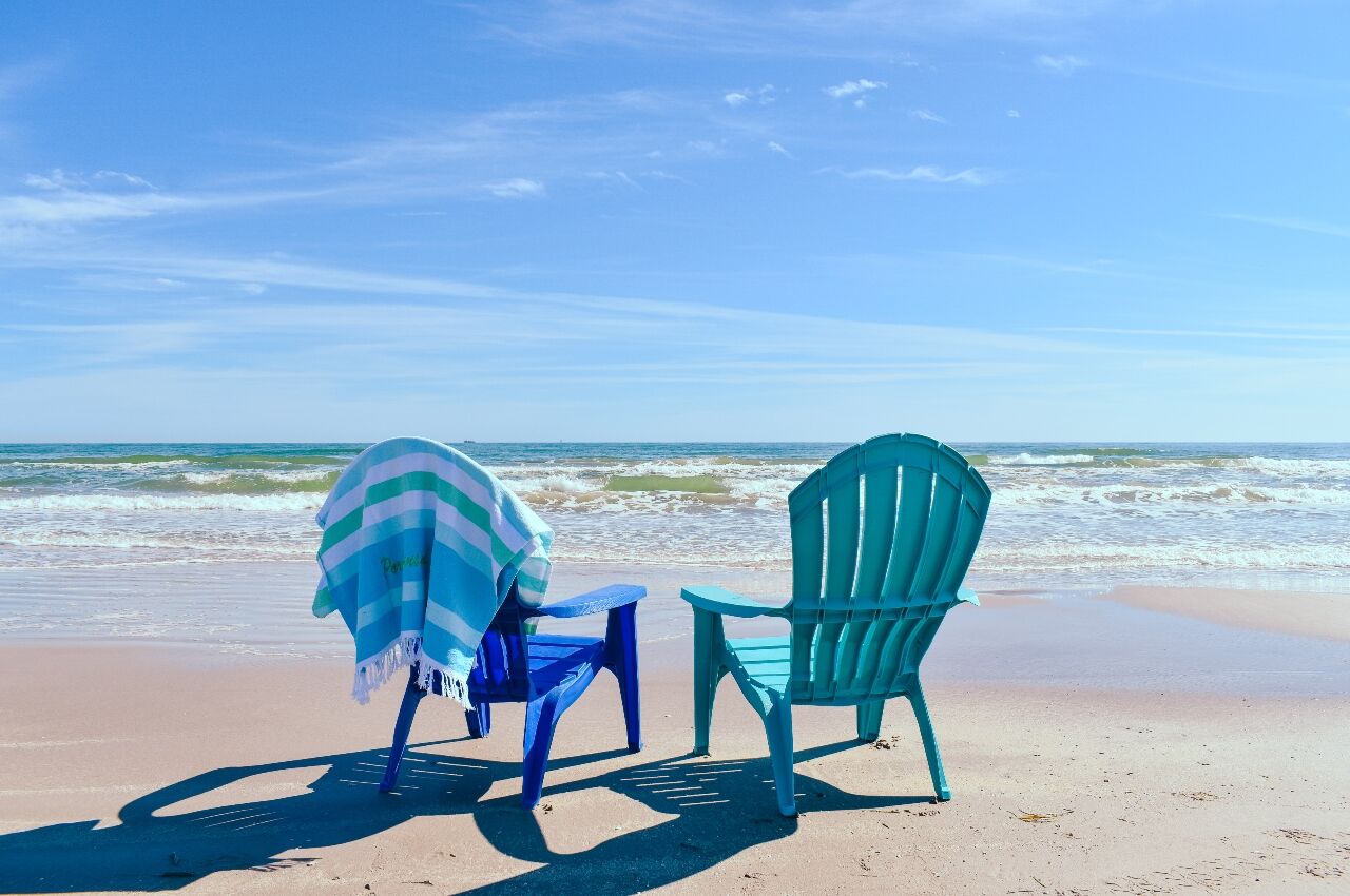 Chairs on beach in Port Aransas one of the best small towns in Texas 