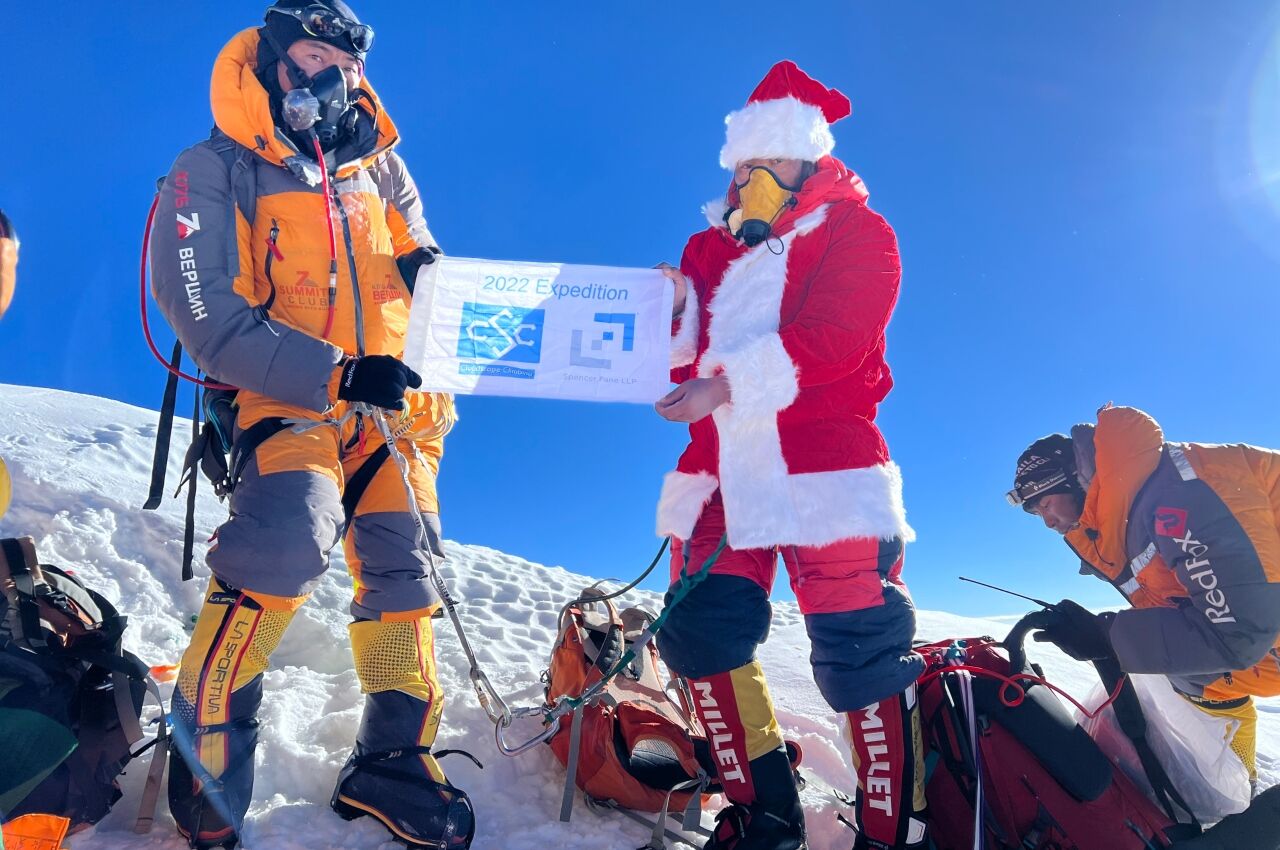 Lhakpa Sherpa at summit of everest in santa costume 