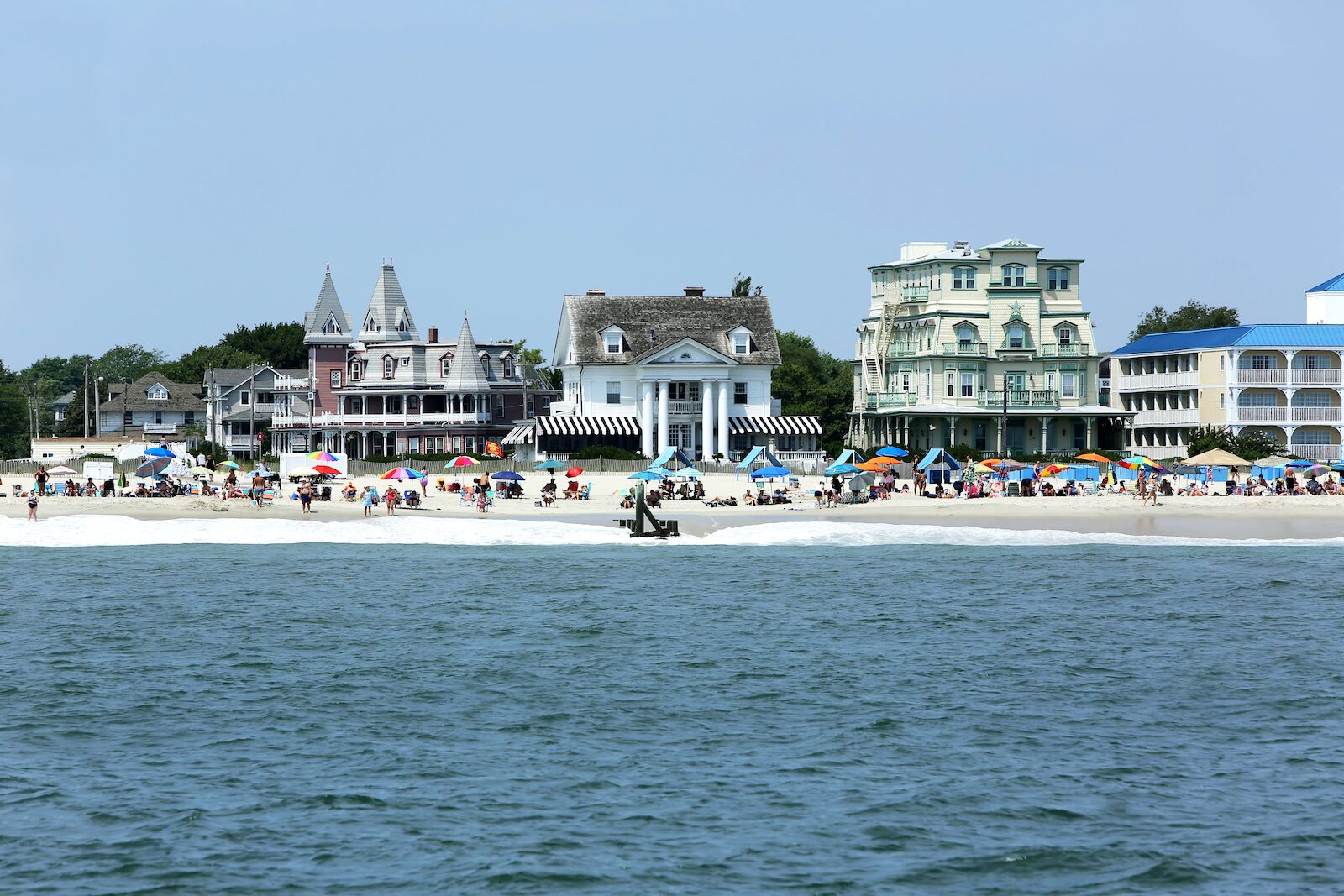 jersey shore beaches cape may beach with victorian houses in the background