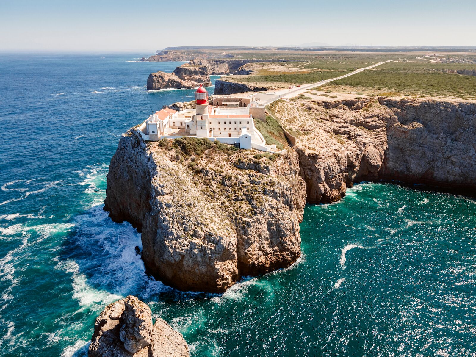 Beautiful lighthouse located on high cliffs of Saint Vincent cape  in Sagres, Algarve, Portugal