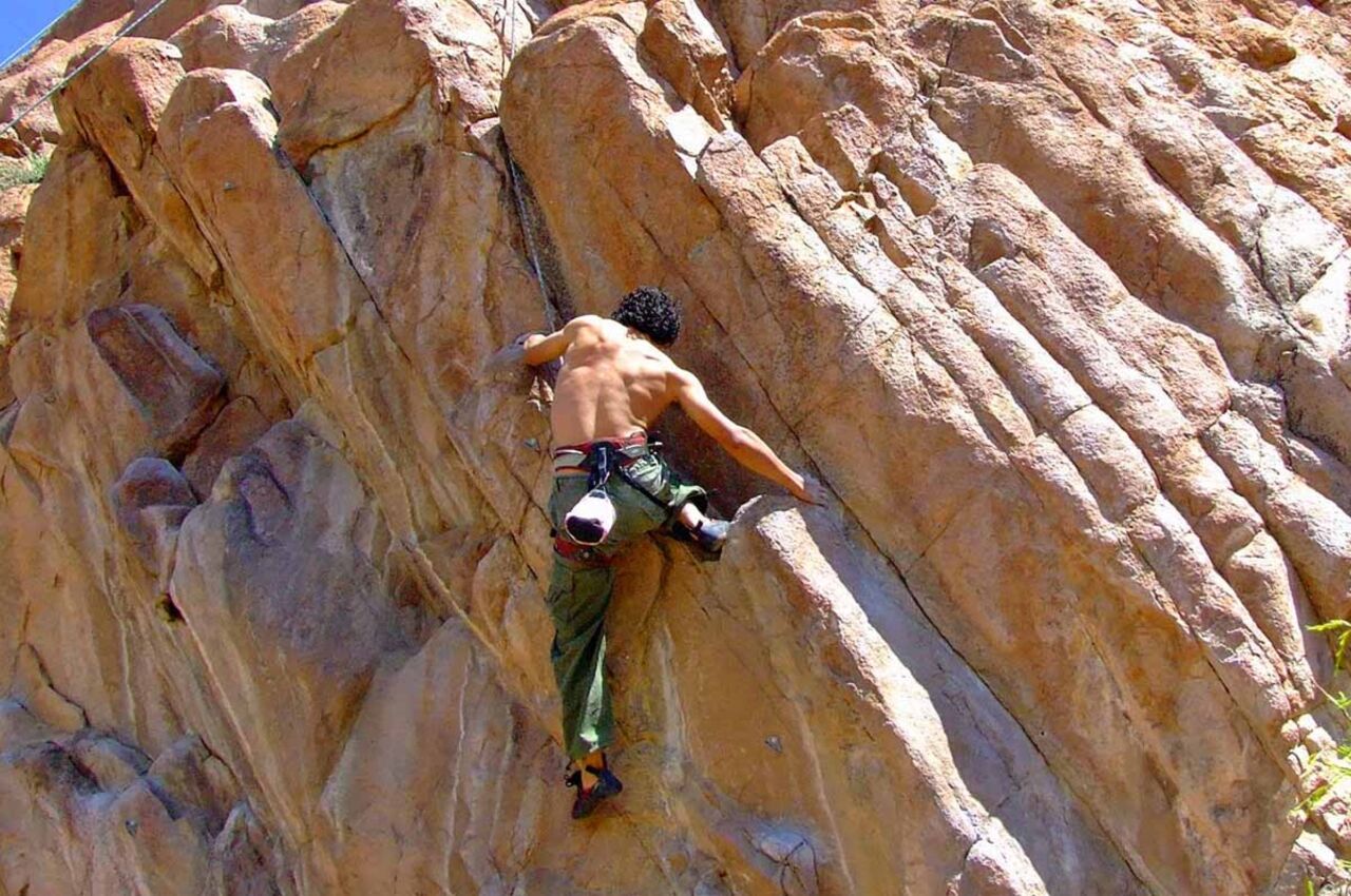 Man climbing at Franklin Mountains one of the best state parks in texas