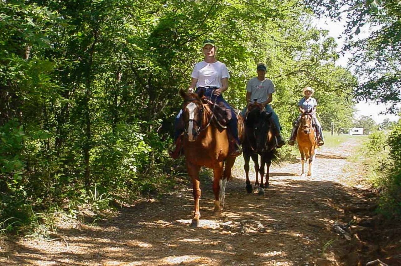 People on horses at Ray Roberts state park in Texas