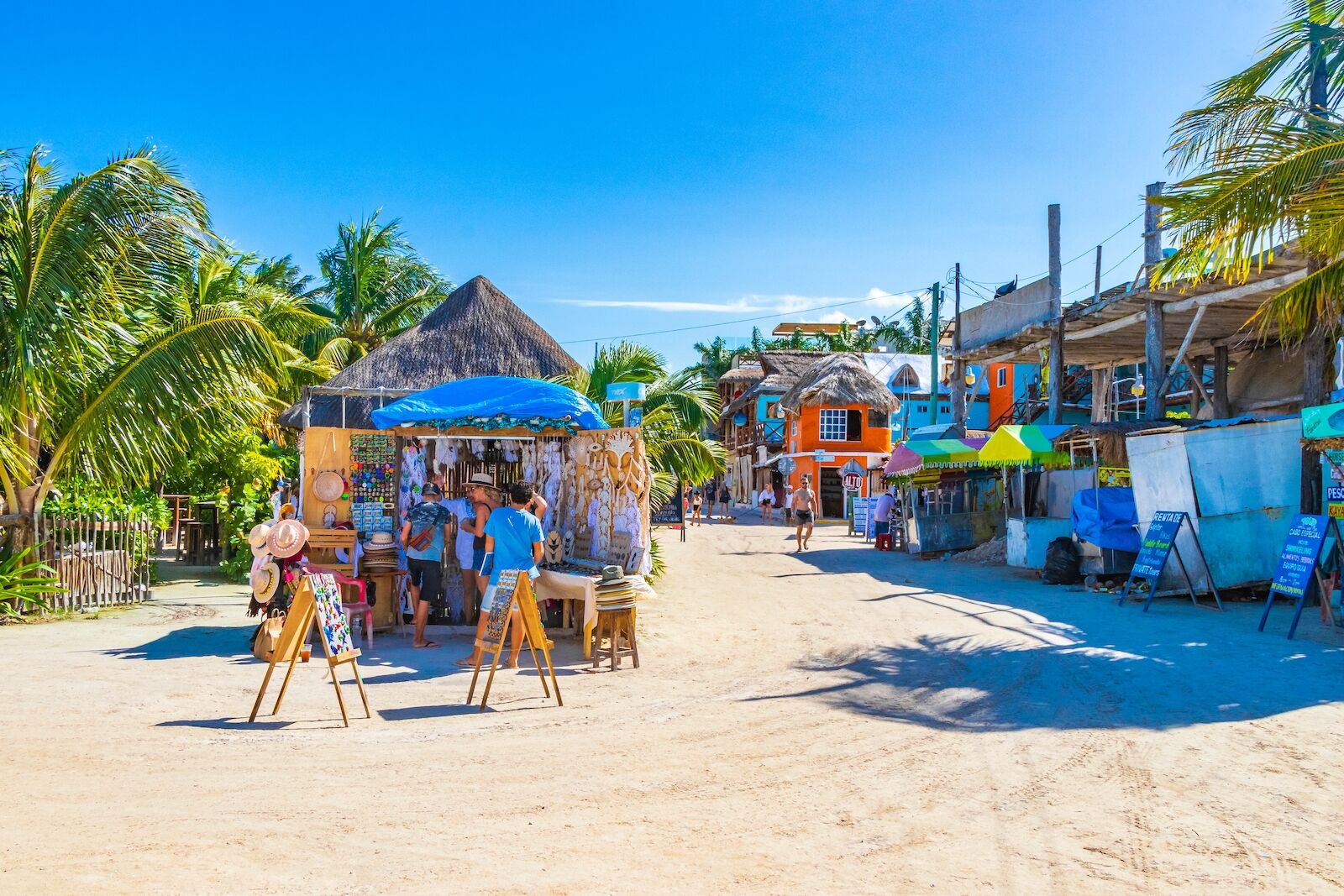 Holbox Mexico 21. December 2021 Panorama landscape view on beautiful Holbox island sandbank and beach with entrance people stores bars and palm trees in Quintana Roo Mexico.