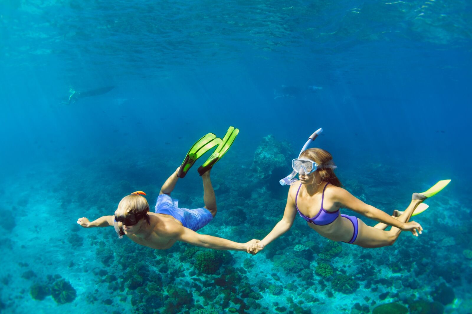 Couple snorkeling off Nusa one of the bali islands 
