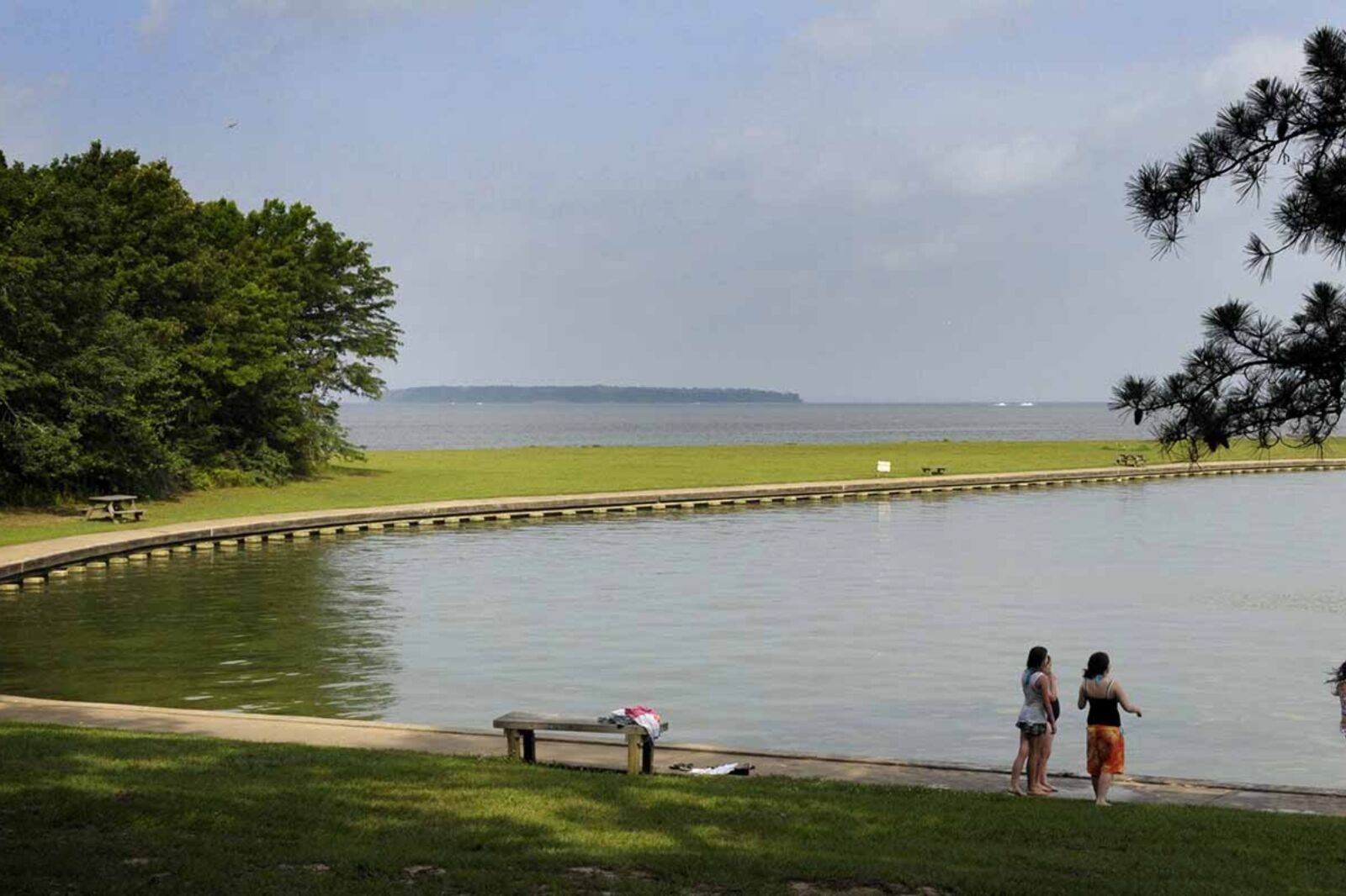 People standing by Lake Livingston one of the best places for camping in Houston