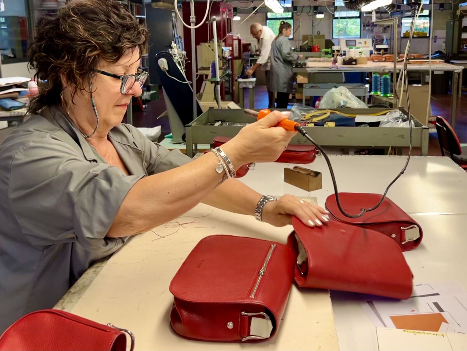 woman working with leather at pierotucci in florence
