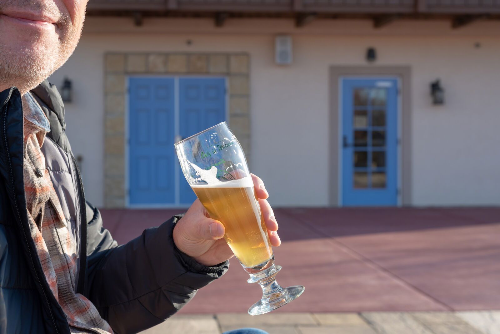 New Glarus, WI/USA - 10-27-2019: Man enjoying a beer at an outdoor beer garden