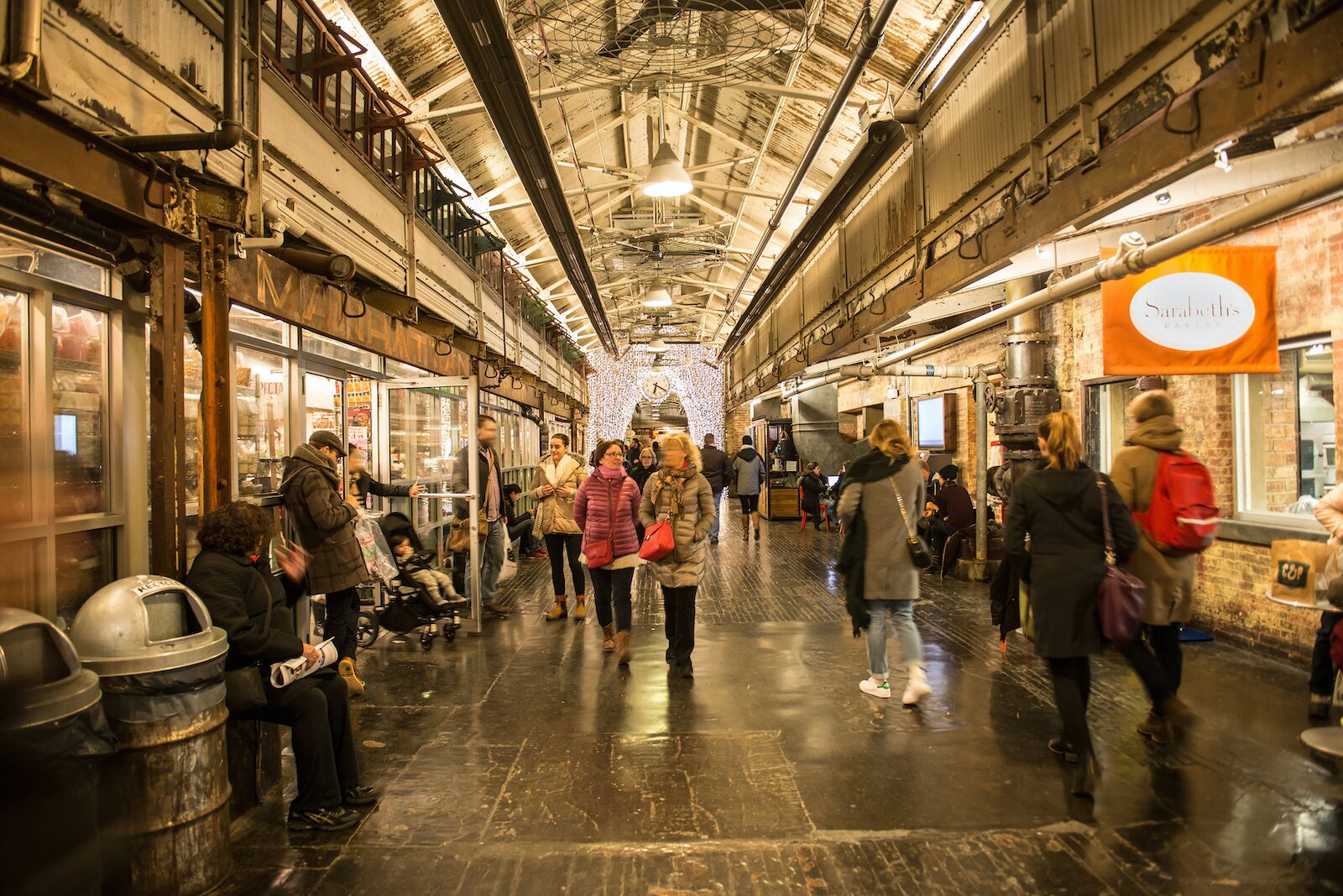 interior chelsea market with customers walking