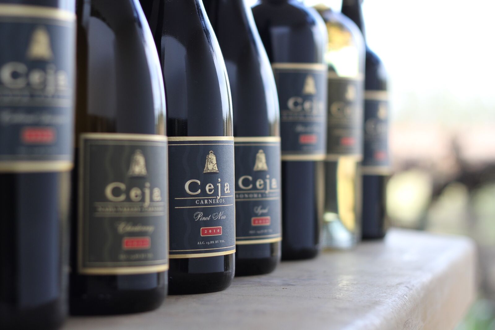 Ceja Wine Bottles lined up on the counter, sonoma tasting rooms