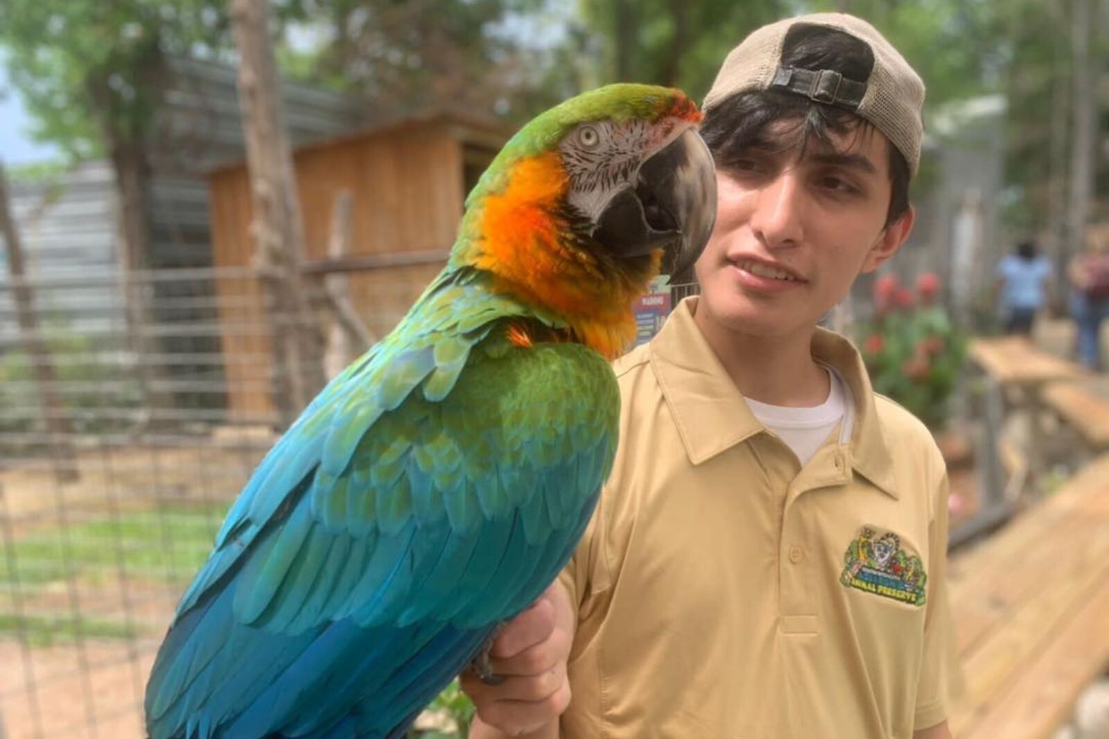 Man with bird at Houston Interactive Aquarium 