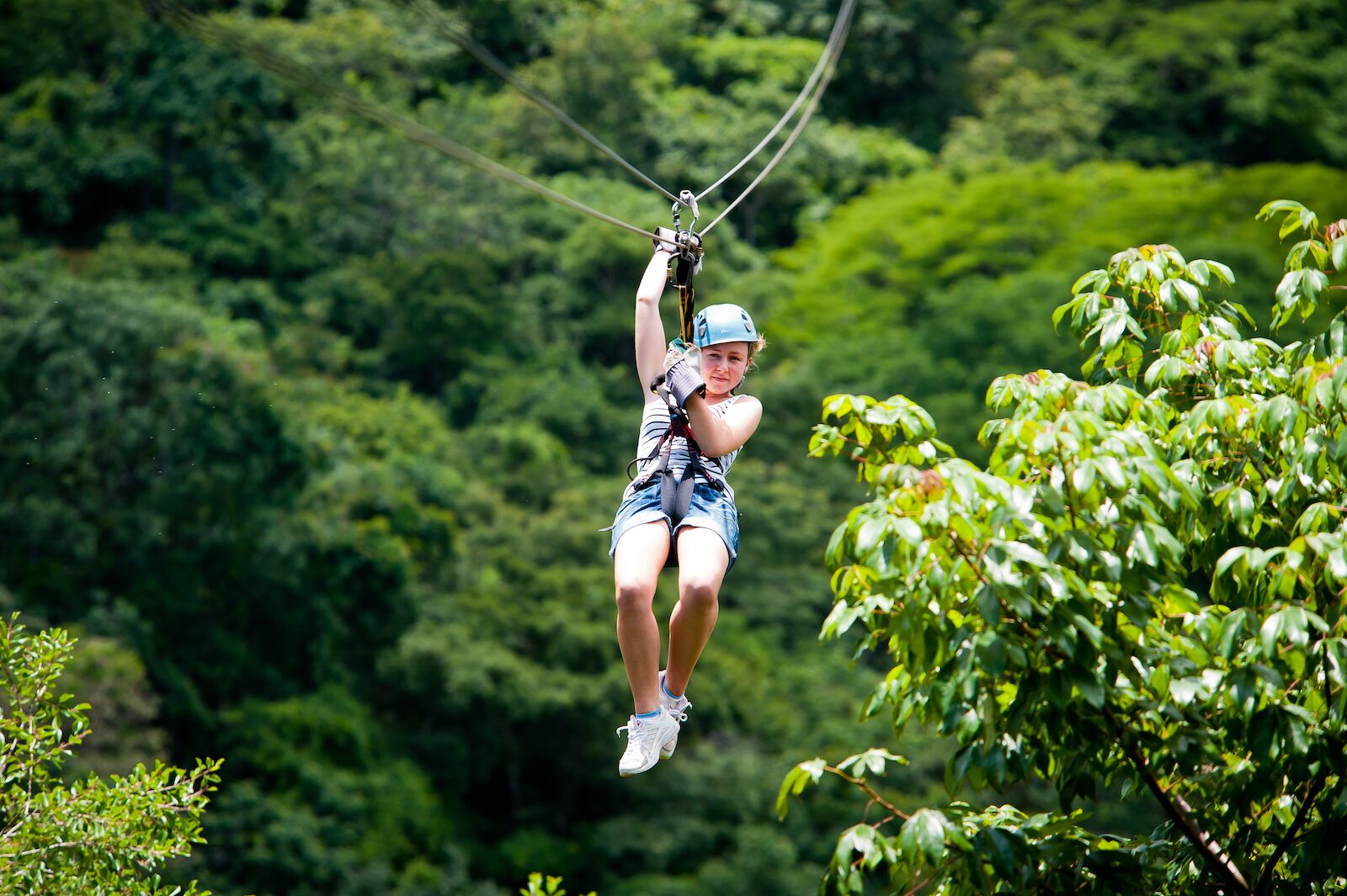 Ziplining above the forest floor in Costa Rica. Read on to know when is the best time to visit Costa Rica for an outdoor adventure