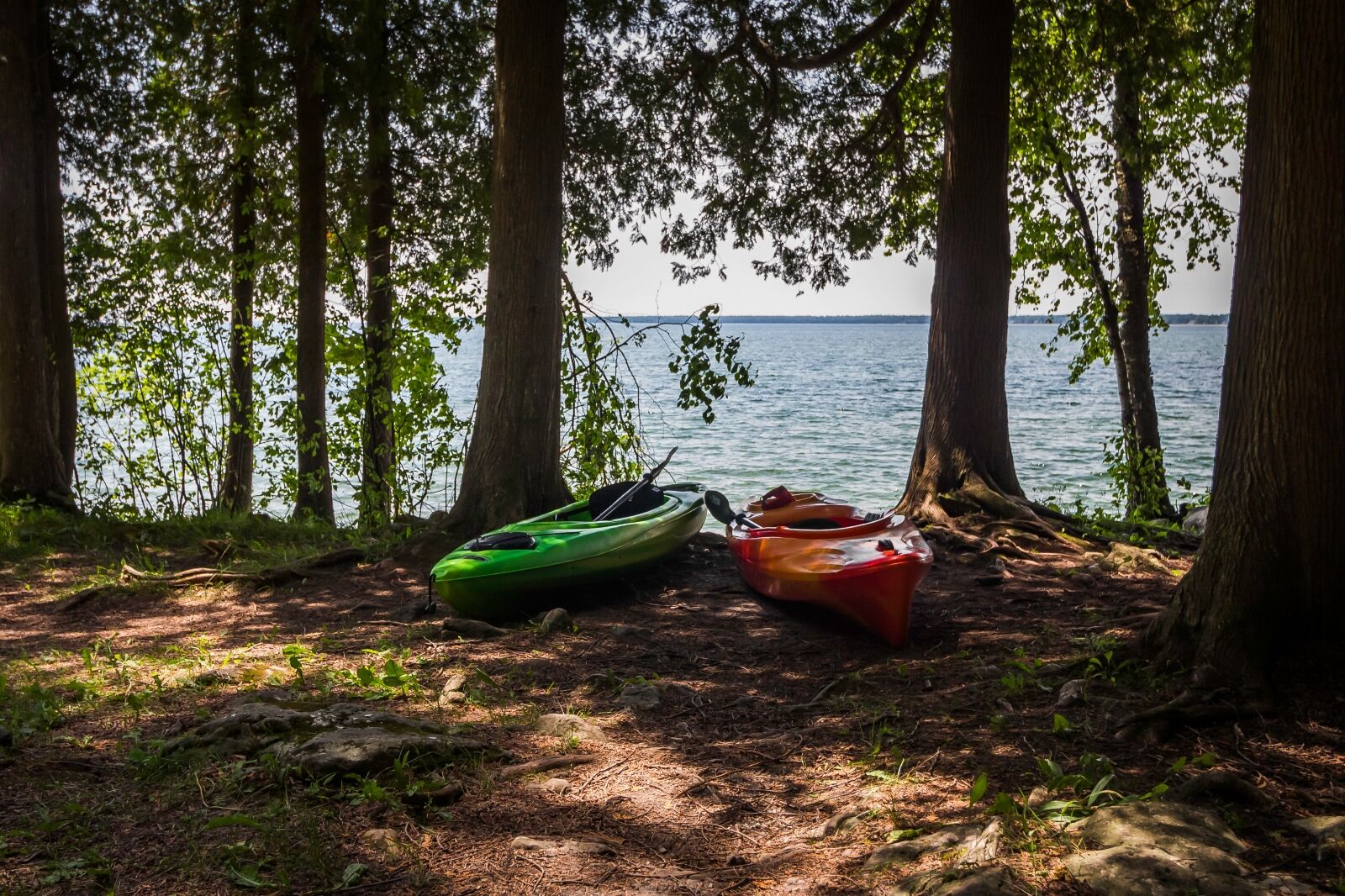 Two kayaks beside Seven Lakes State Park