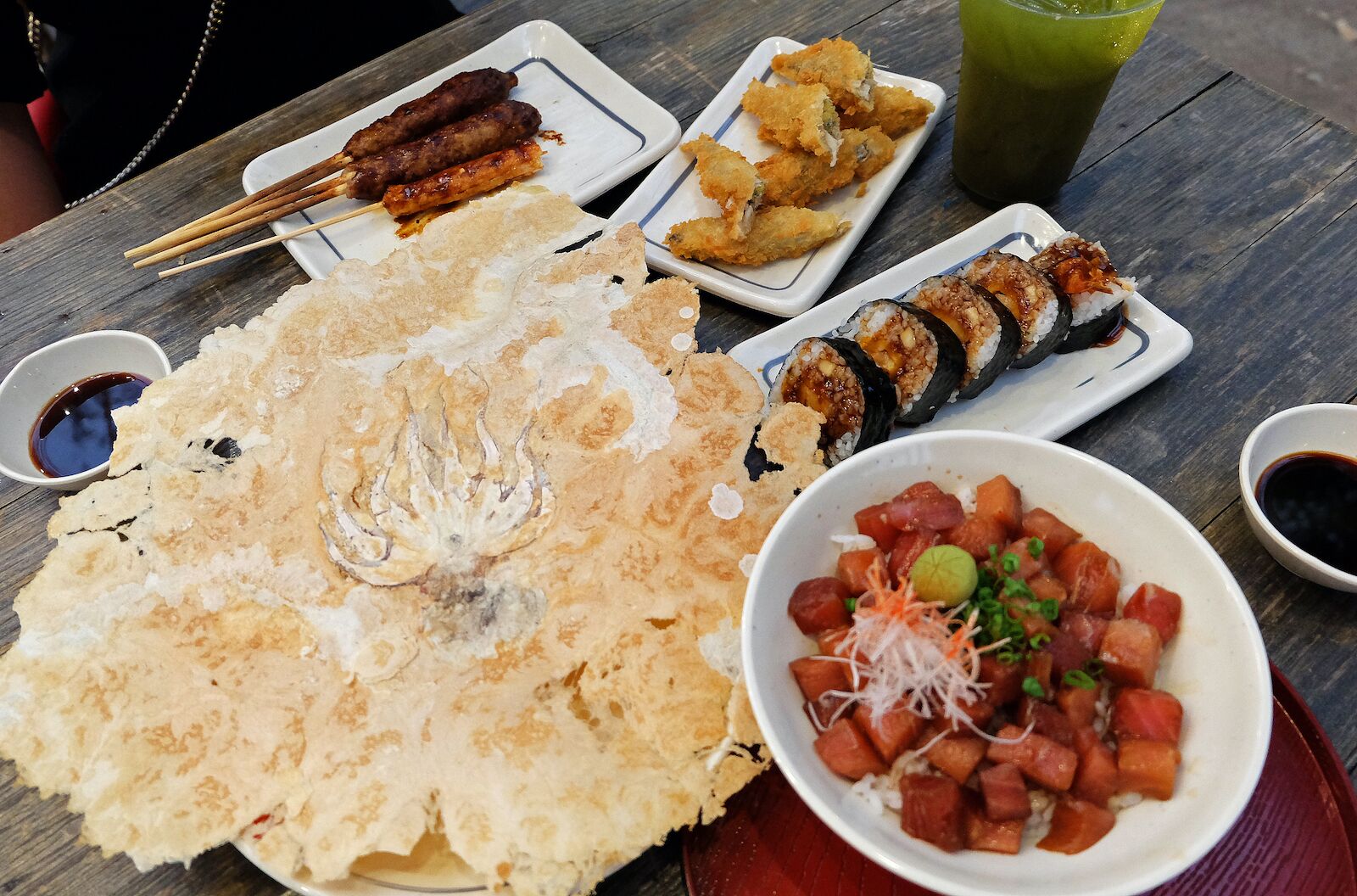 octopus senbai on a table with other types izakaya and green tea-types of senbei