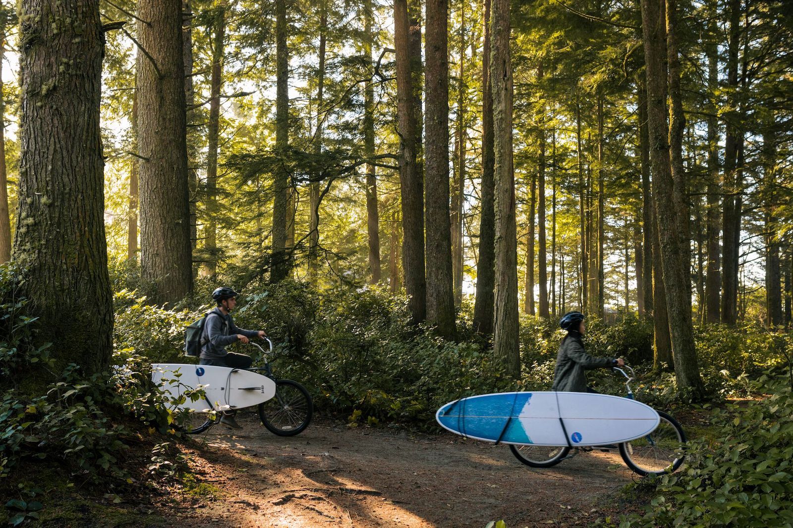 tofino bc cyclists with boards