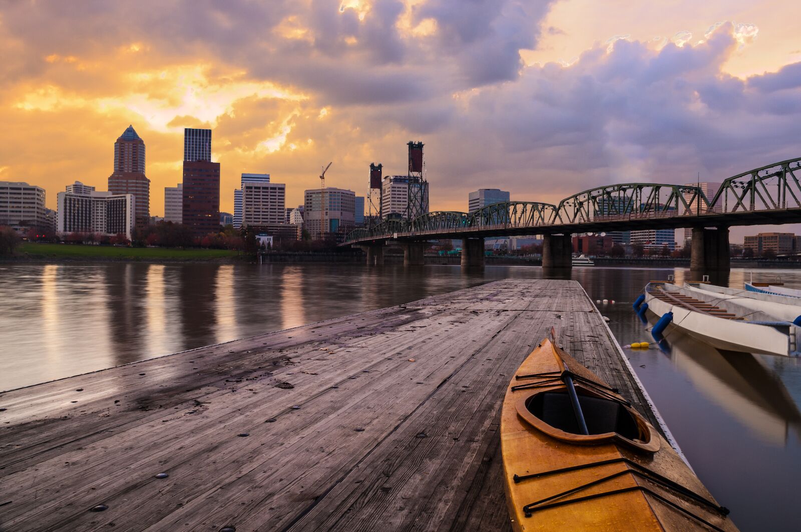 Portland, Oregon Panorama.  Sunset scene with dramatic sky and light reflections on the Willamette River. 