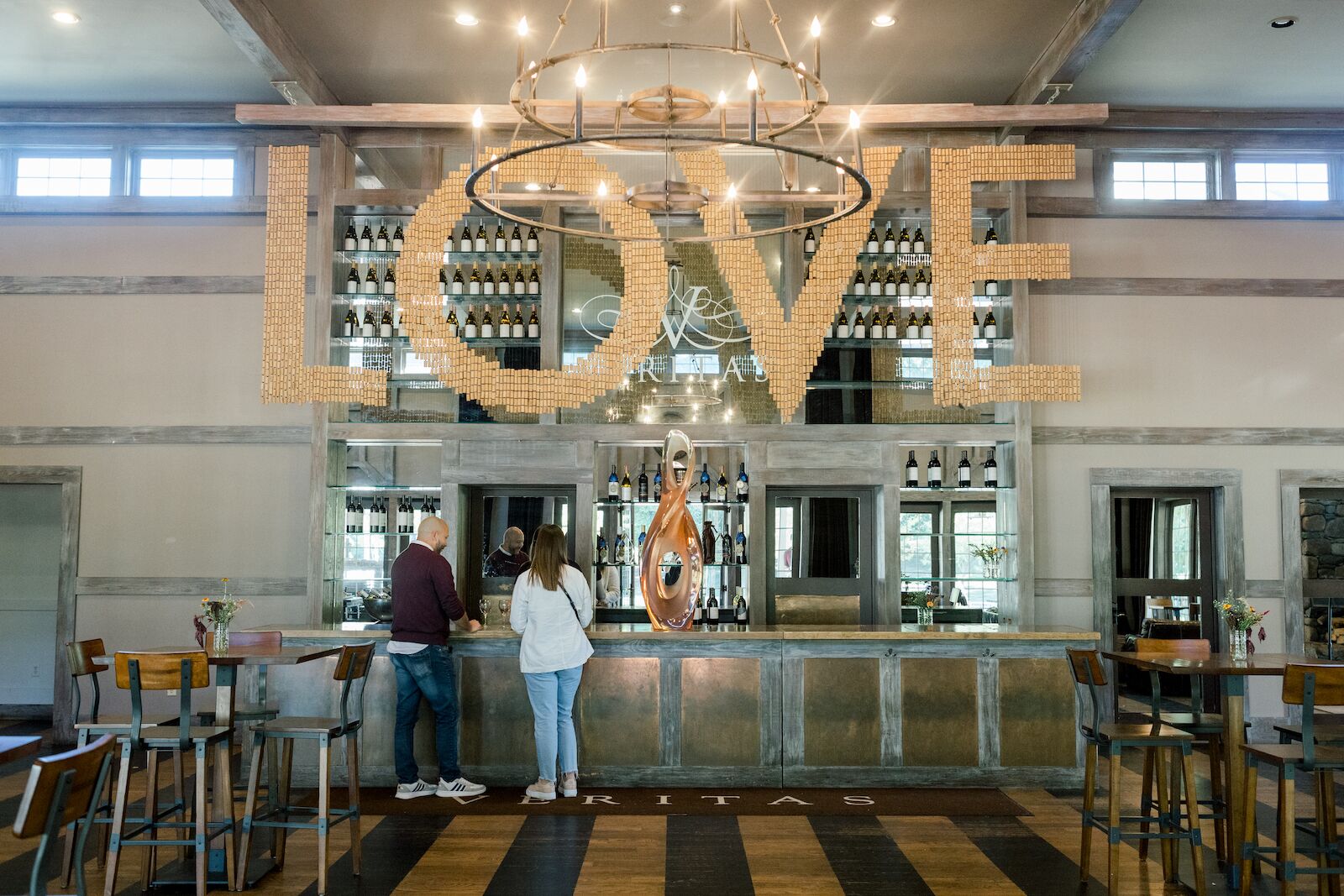 Large Love sign hanging from the ceiling inside the tasting room at Veritas Winery on Nelson 151