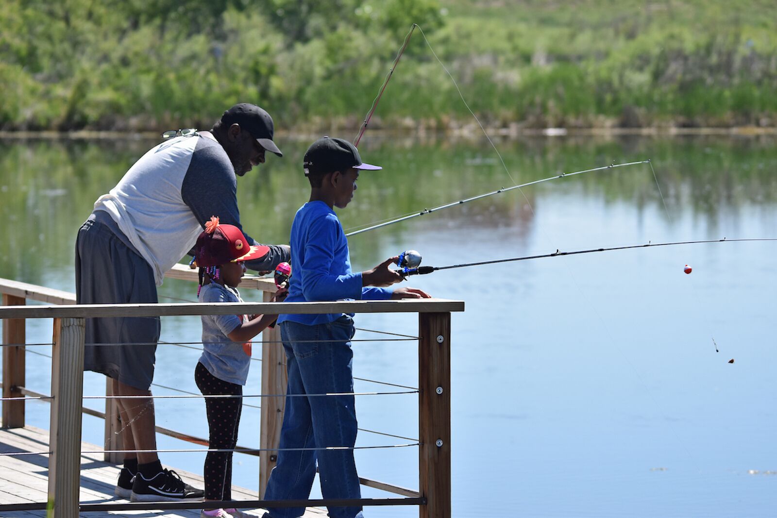 dad and two kids fishing in the best colorado state parks 