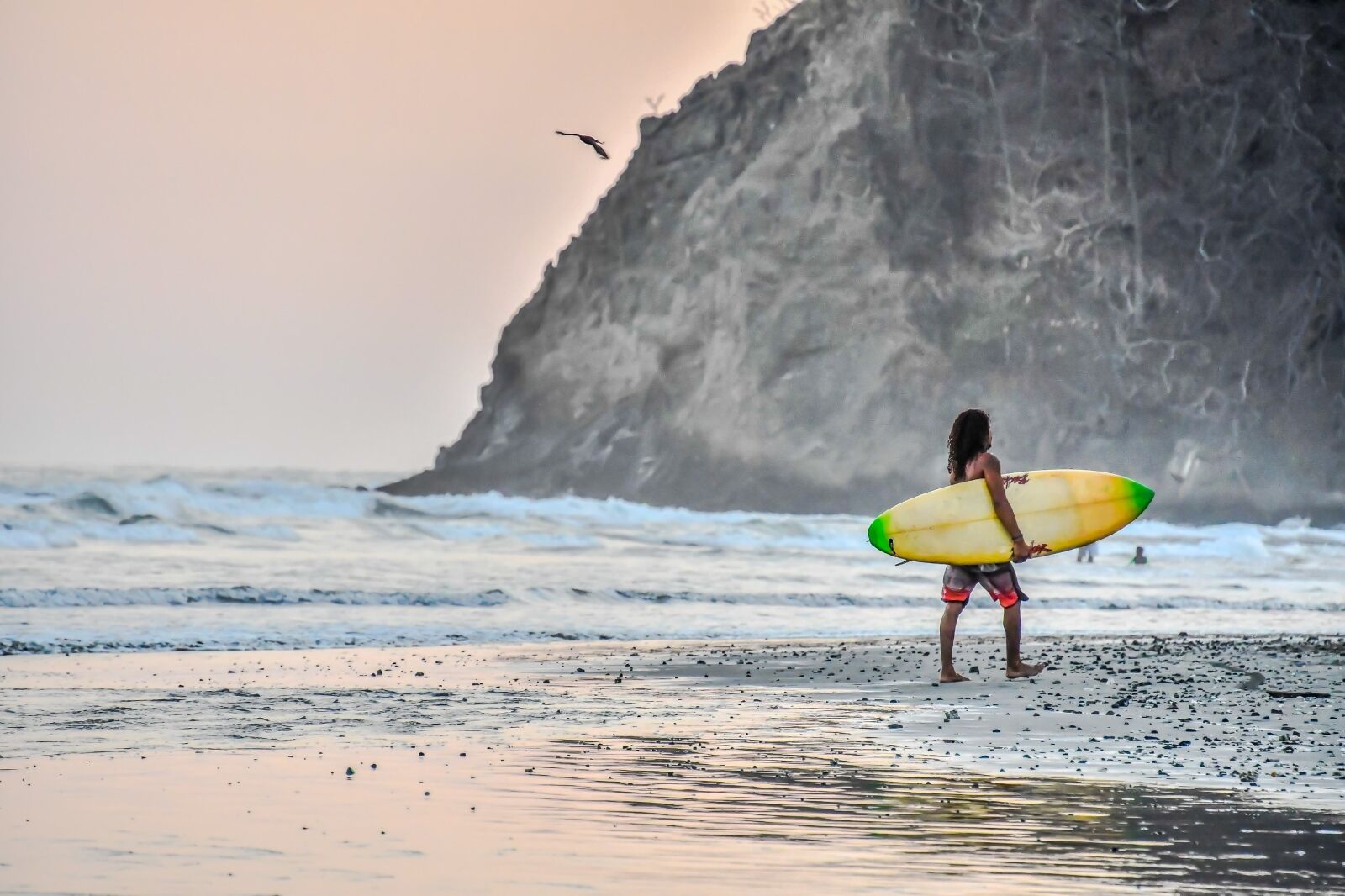 surfer with board in Nicoya in the blue zone costa rica
