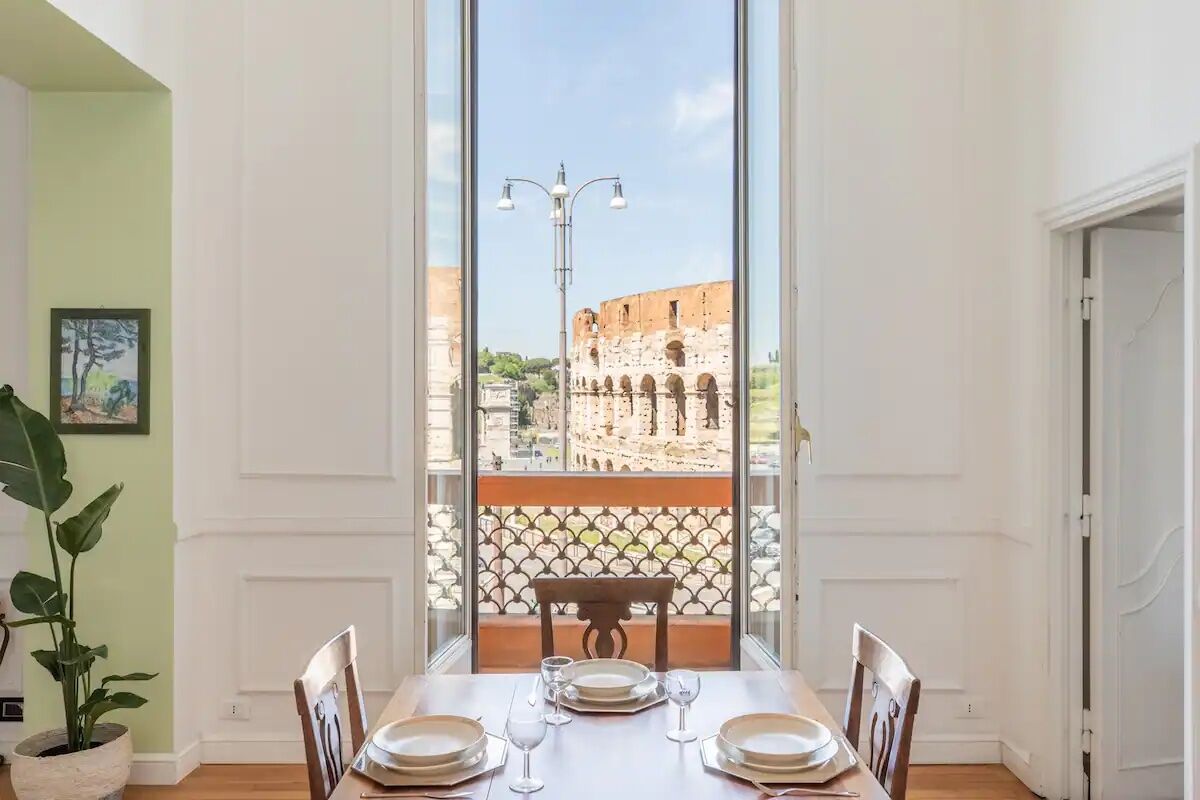 dining table overlooking colosseum at iflat airbnb in rome