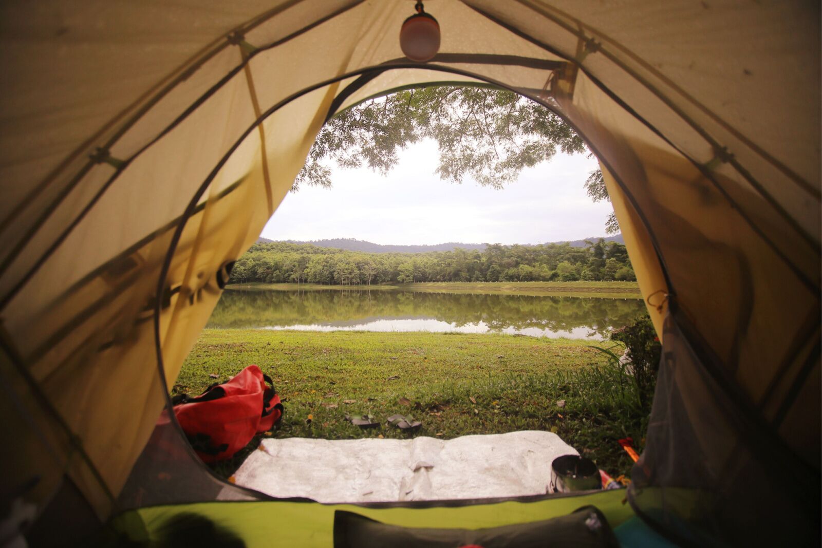 camping in front of peaceful lake 
