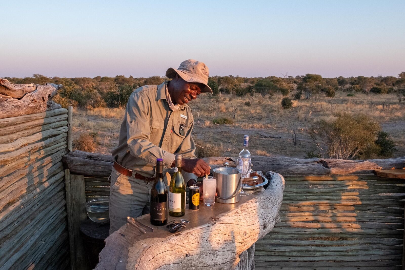 Man making drinks at Skybeds Botswana camp