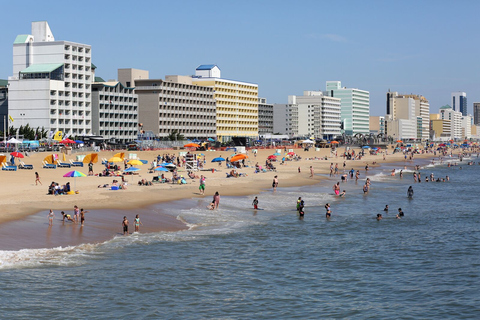 Virginia Beach, Virginia USA: June 2, 2018:  On a beautiful summer day tourist who visit the resort city of Virginia Beach have fun  in the water and on the sand.