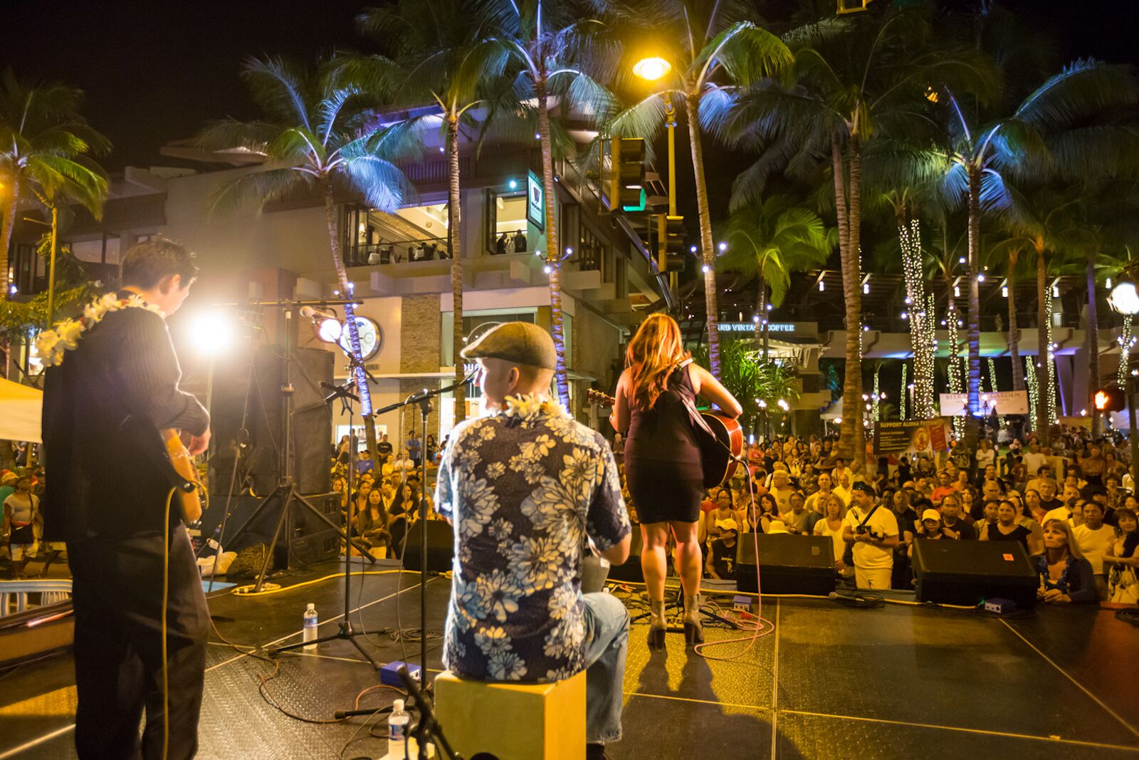 best time to visit hawaii festival performers on stage