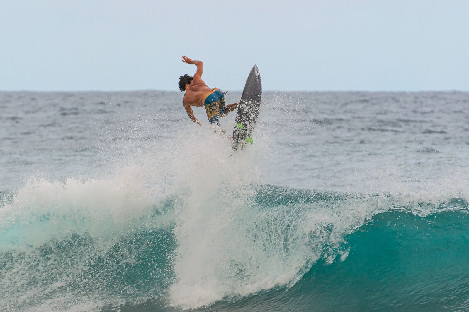 Man surfing in competition in Puerto Rico the best time to visit Puerto Rico to visit