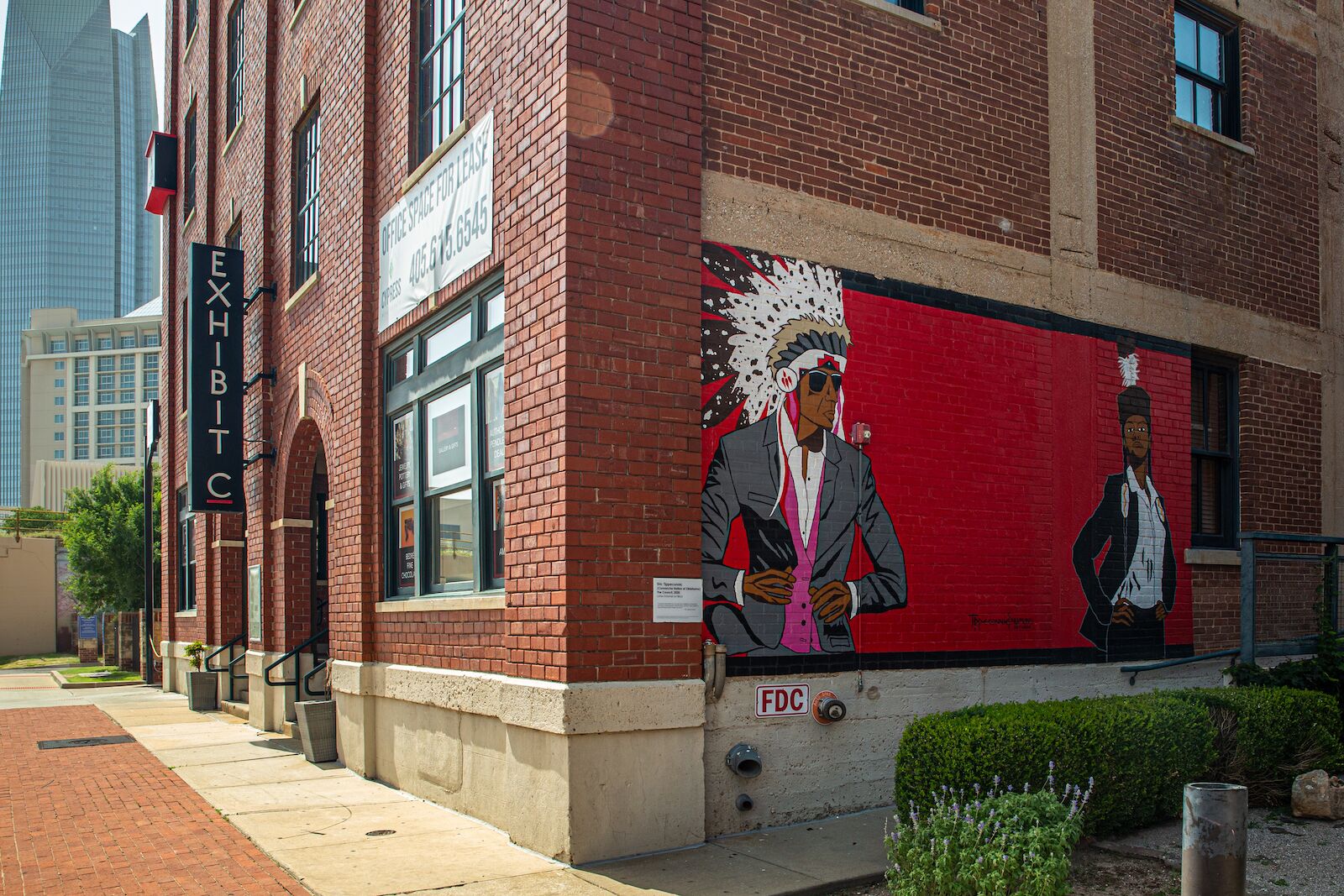exterior of Exhibit C in Bricktown with mural on the brick wall, museums in Oklahoma City