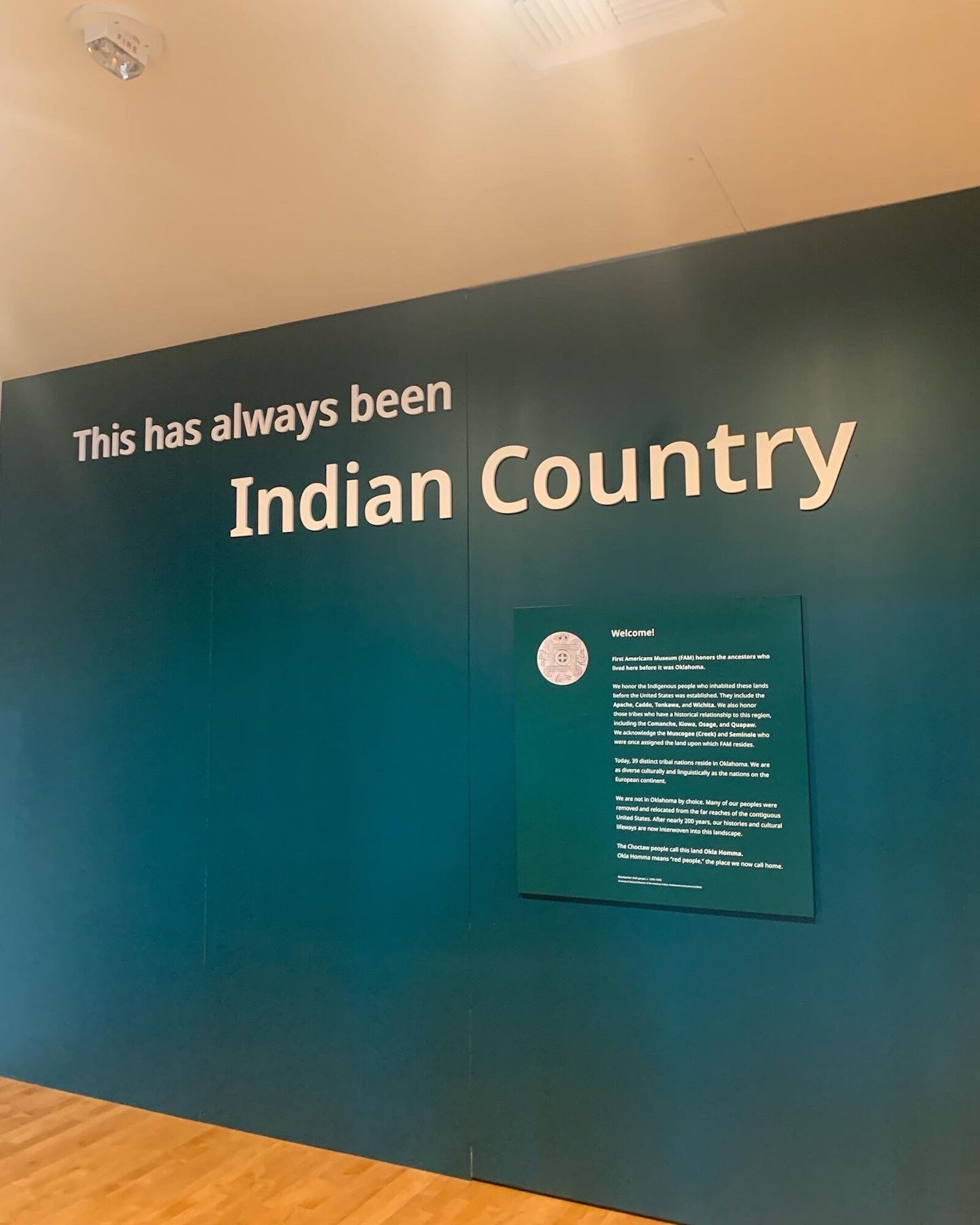 sign at the entrance to the First Americans museum that reads "this has always been Indian country" 