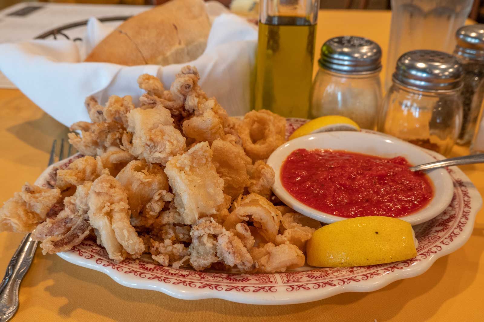 plate of fried-calamari with a side of marinara at Chiapparellis, one of the Baltimore Little Italy restaurants