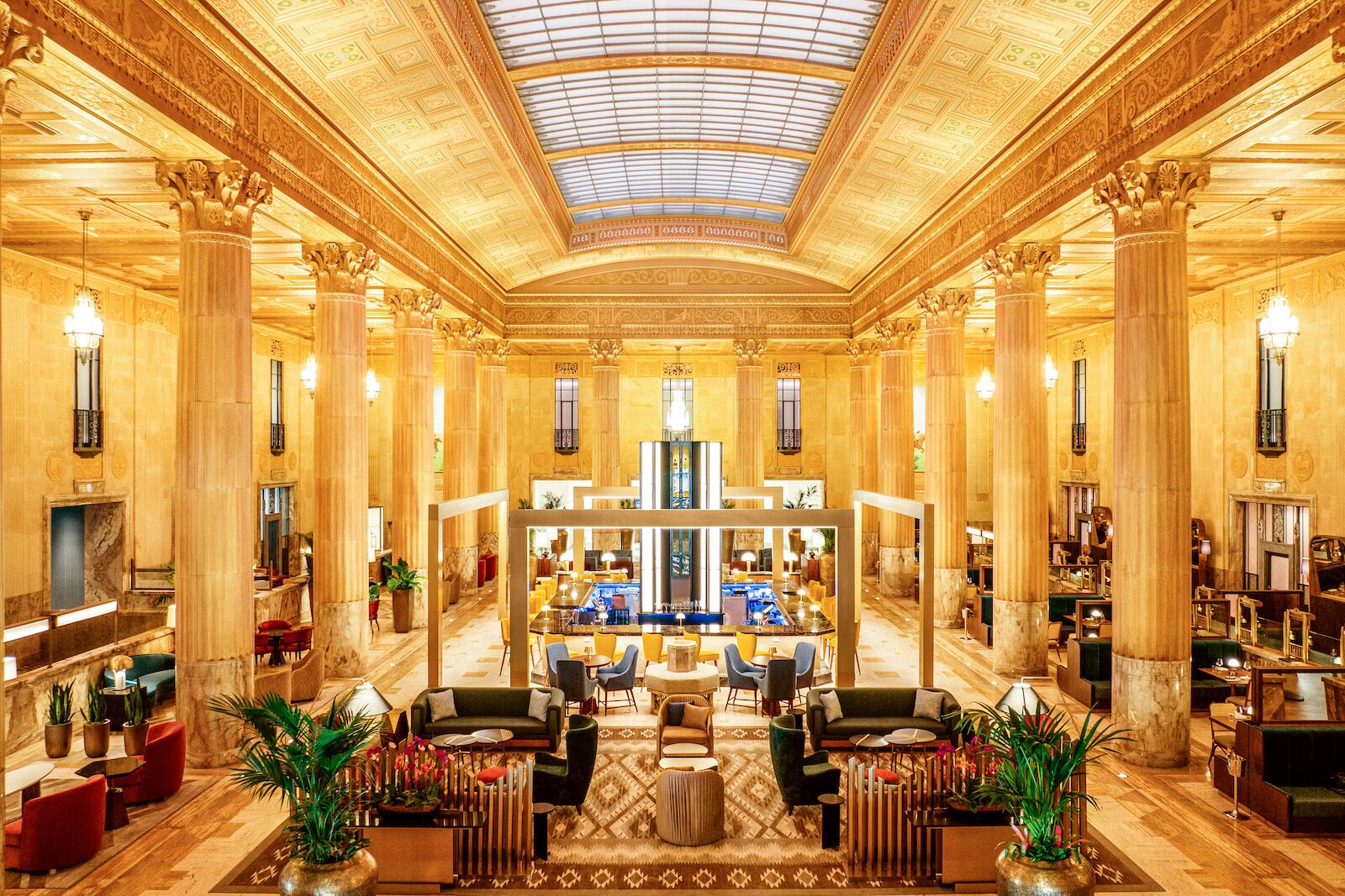 The Great Hall bar and lobby with large columns at The National hotel