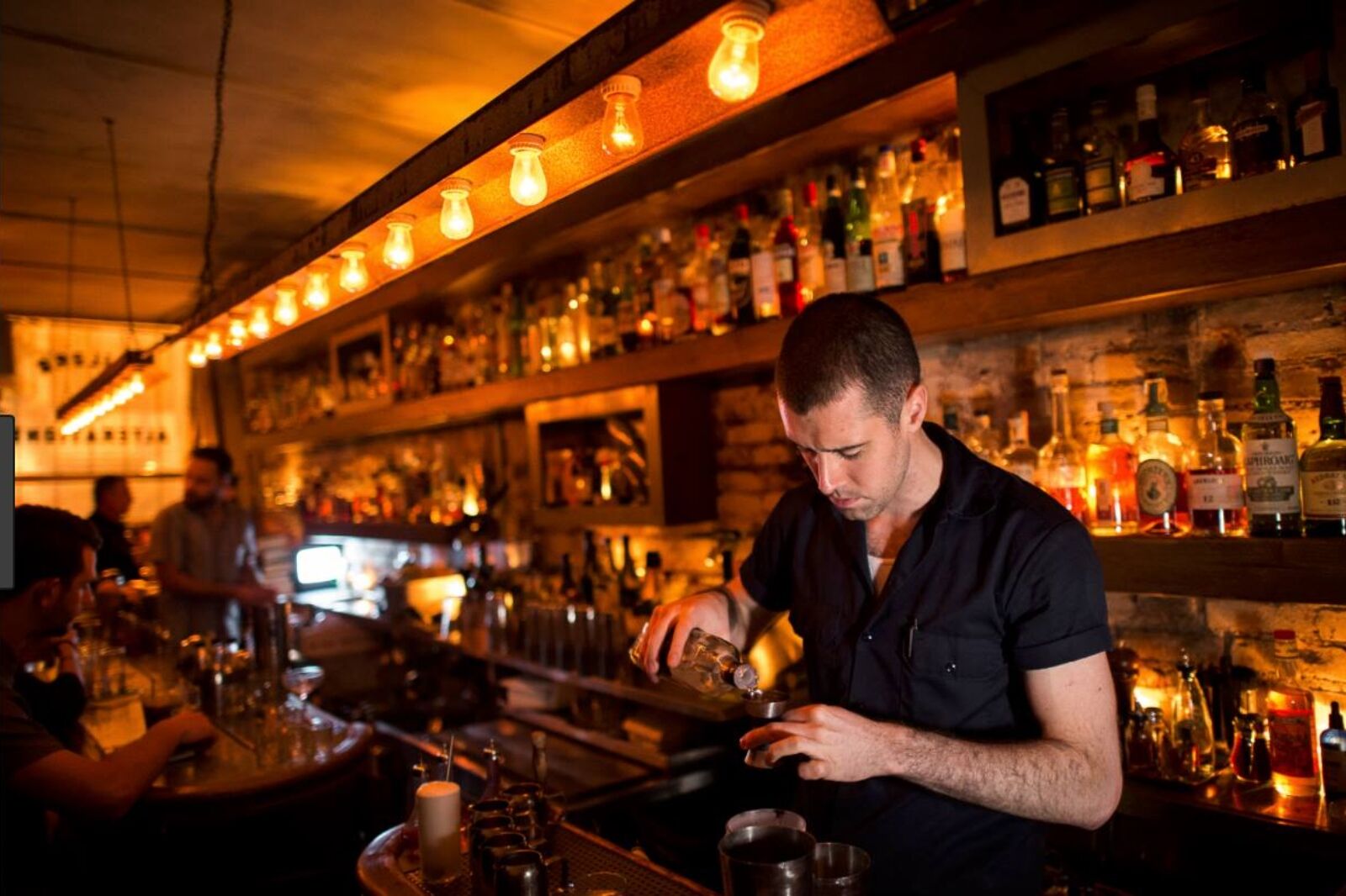 Bartender makes drink at Attaboy one of the best things to do in nyc