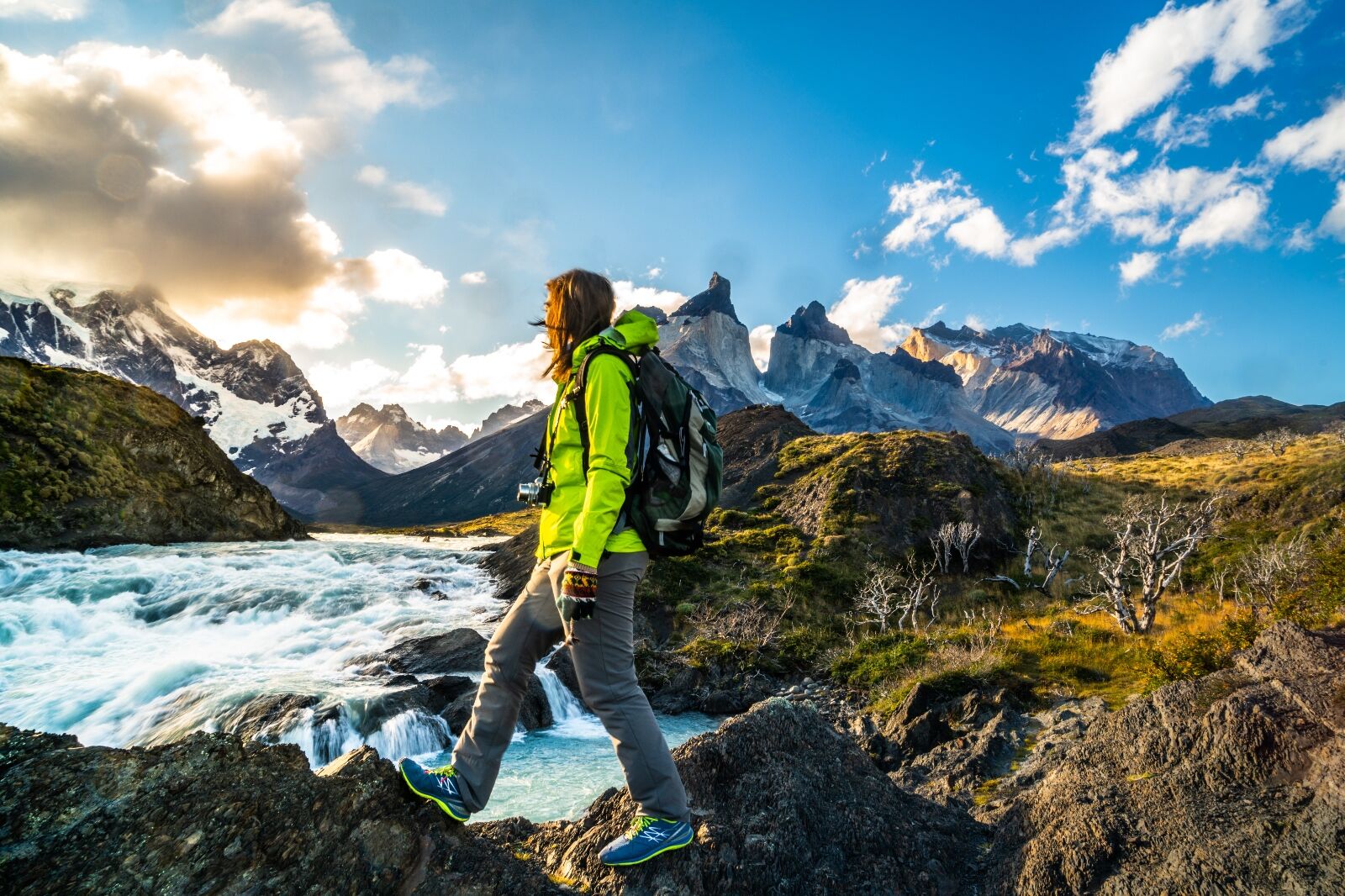 Woman walks in Patagonia, Chile, one of the suggestions on where to travel in December