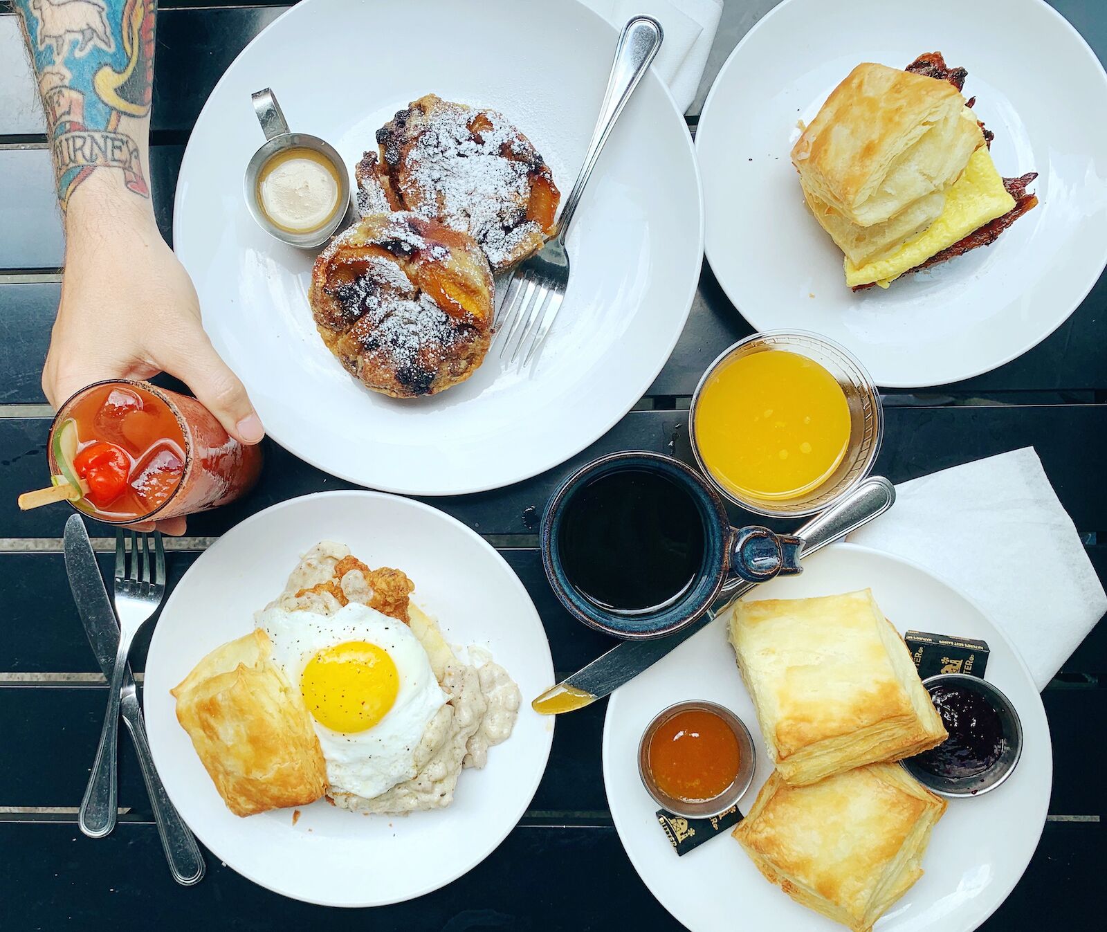 Breakfast dishes on the table at Biscuit Love, Nashville brunch
