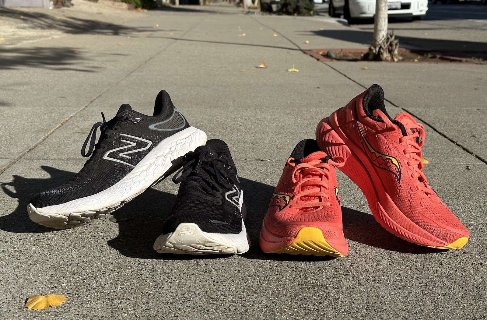 New Balance and Saucony running shoes side by side 