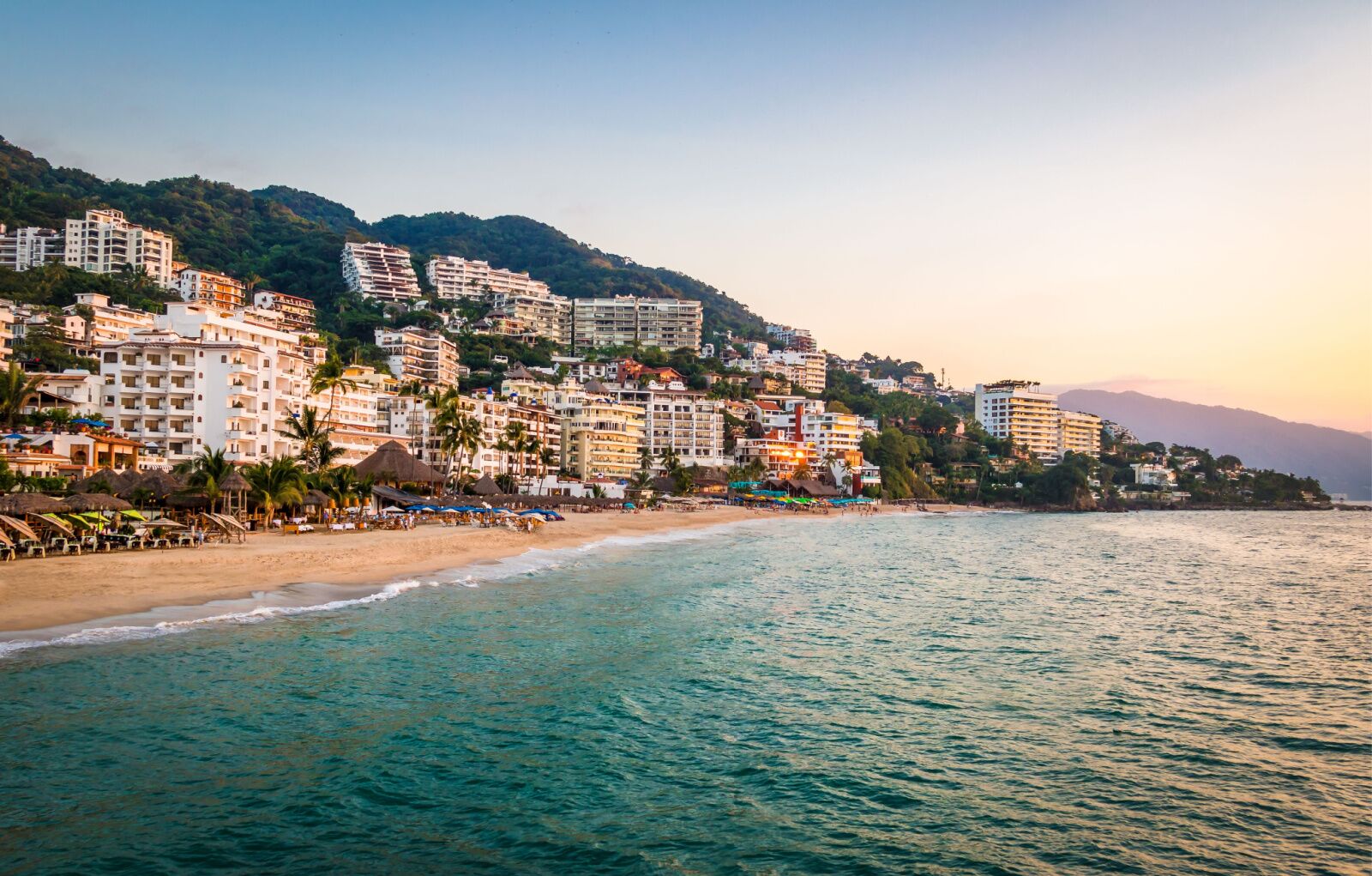 beach and colorful downtown buildings in Puerto Vallarta, one of the best places for couples in Mexico